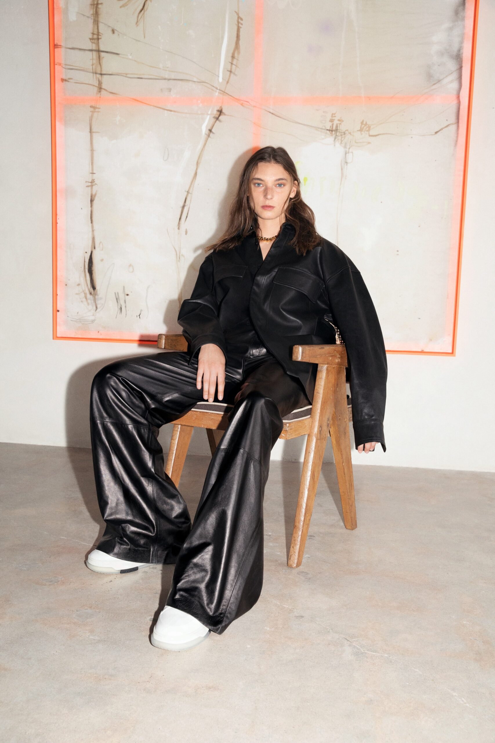 black leather oversized jacket and relaxed pants