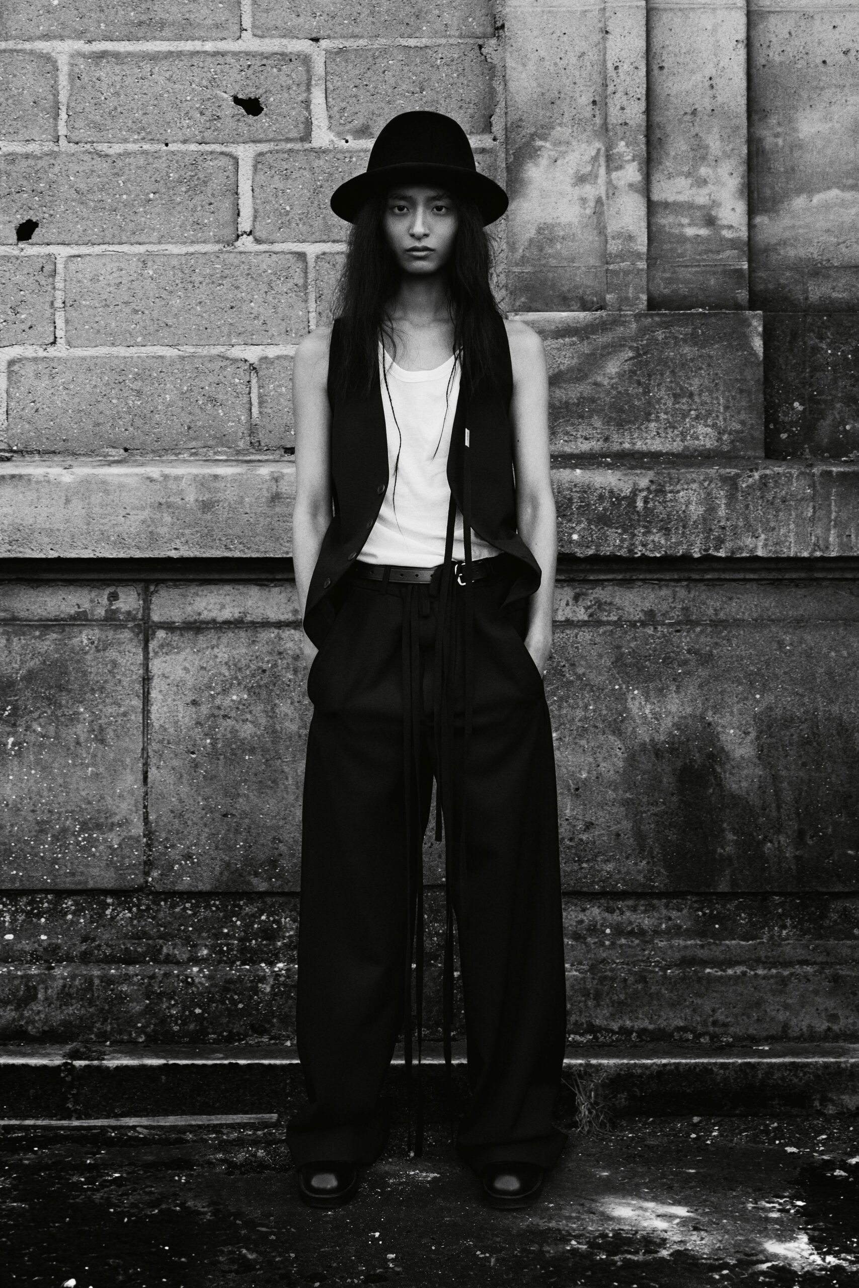 black fitted vest with wide-leg pants