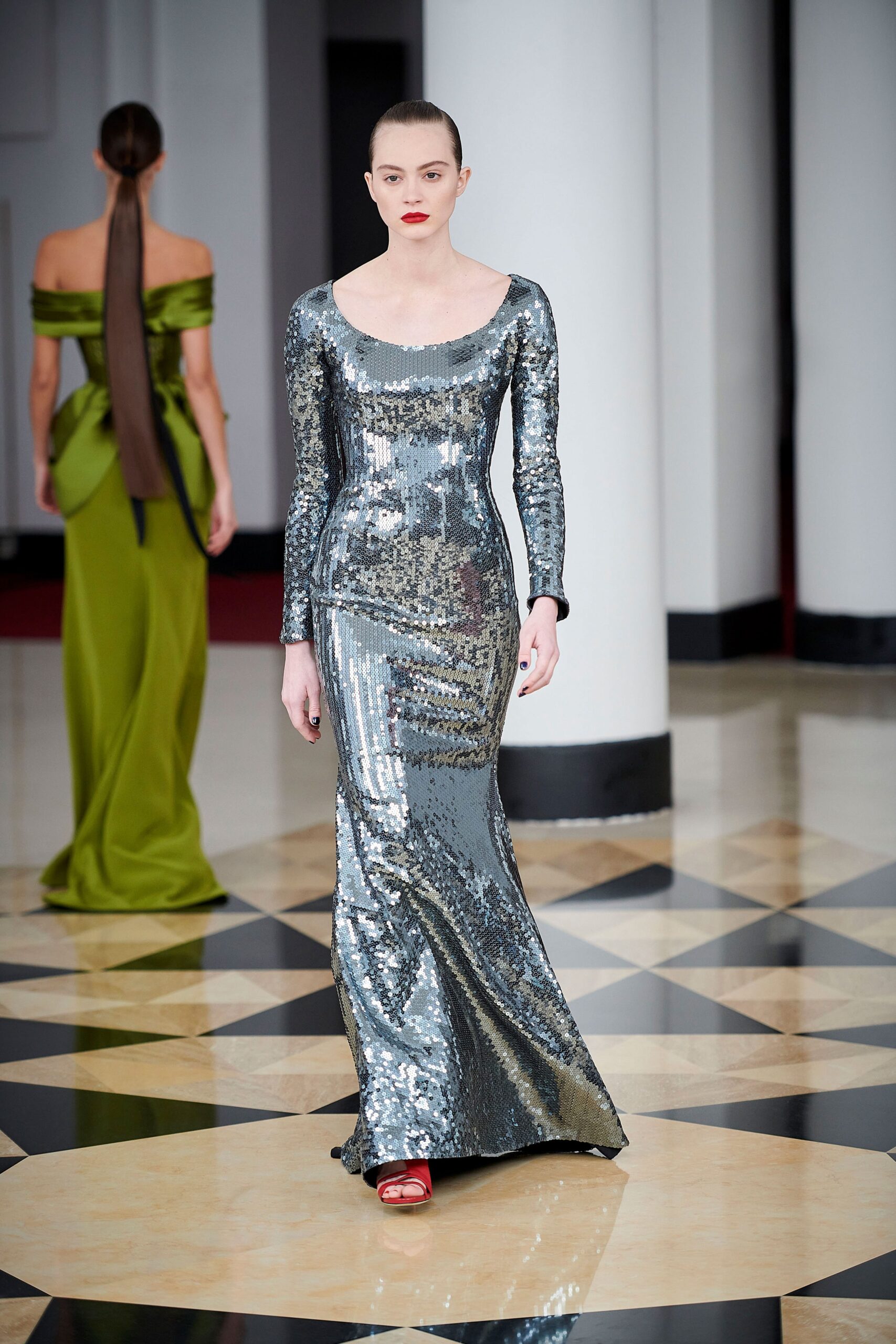 silver sequin fitted gown and green off-shoulder gown