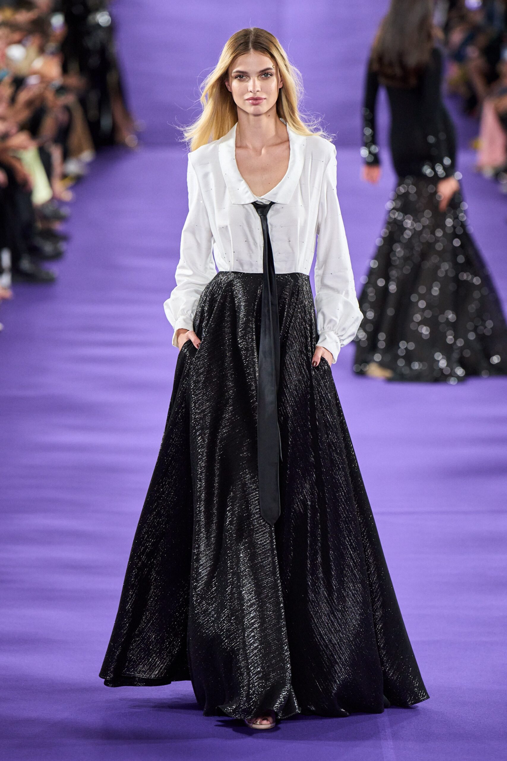 white silk blouse and black skirt