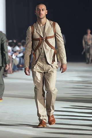 beige tailored suit with brown bag