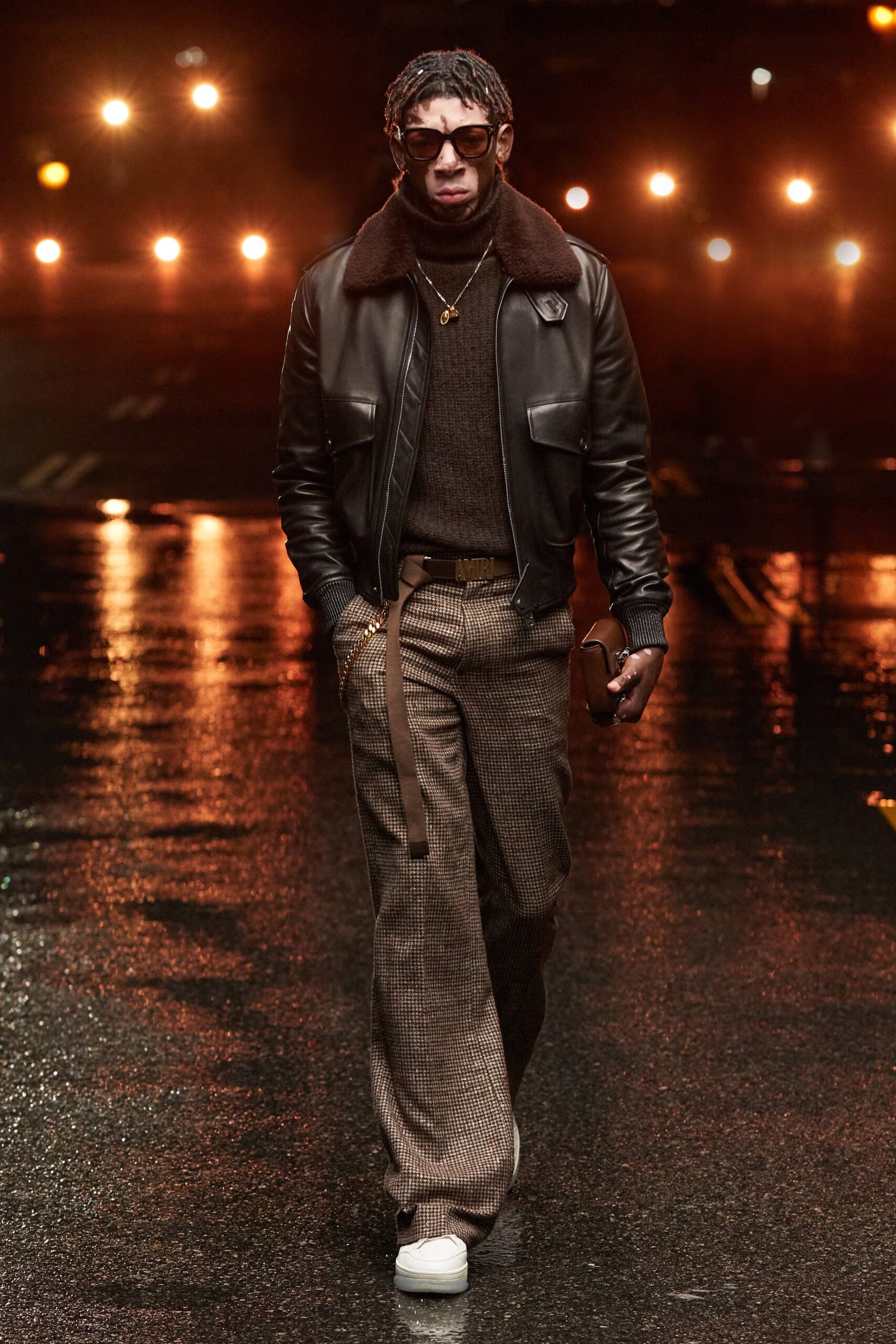 black leather jacket with brown sweater