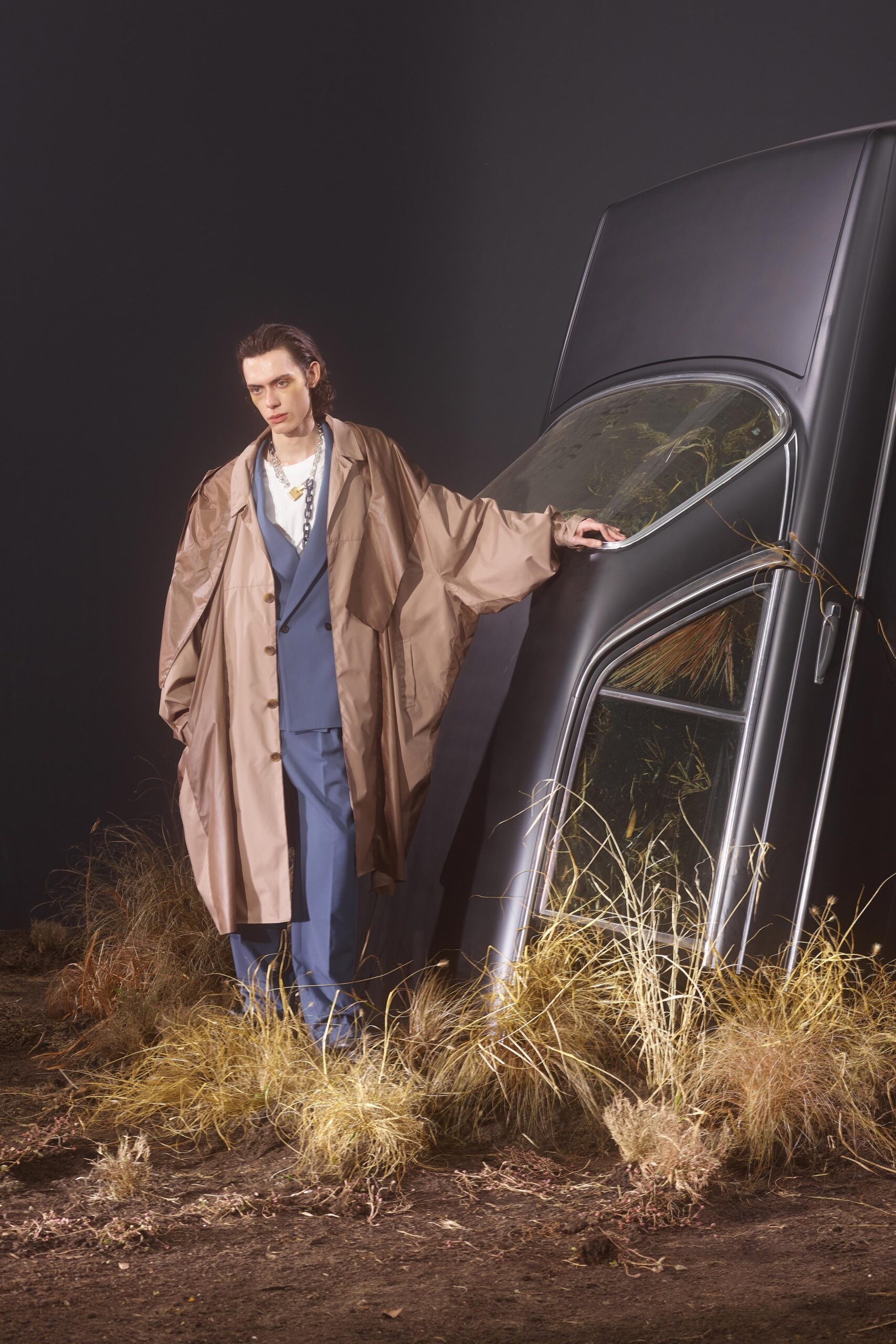 brown silk relaxed coat and blue tailored suit