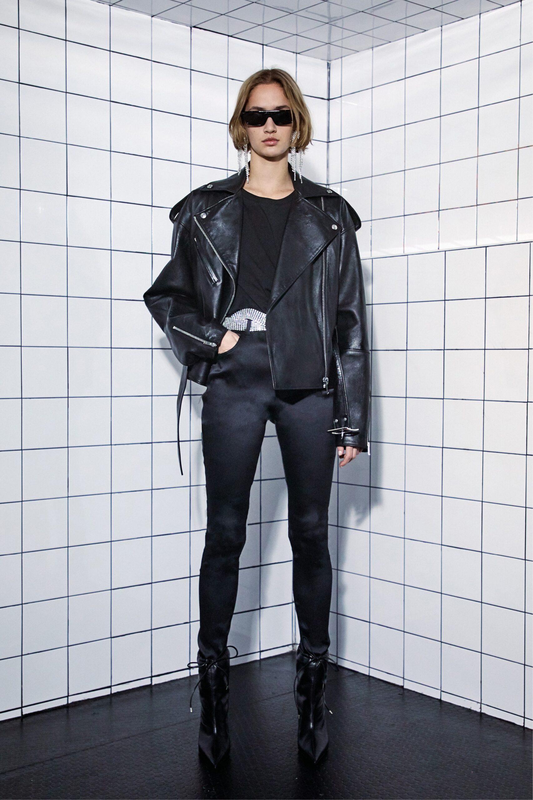 black leather jacket with fitted pants