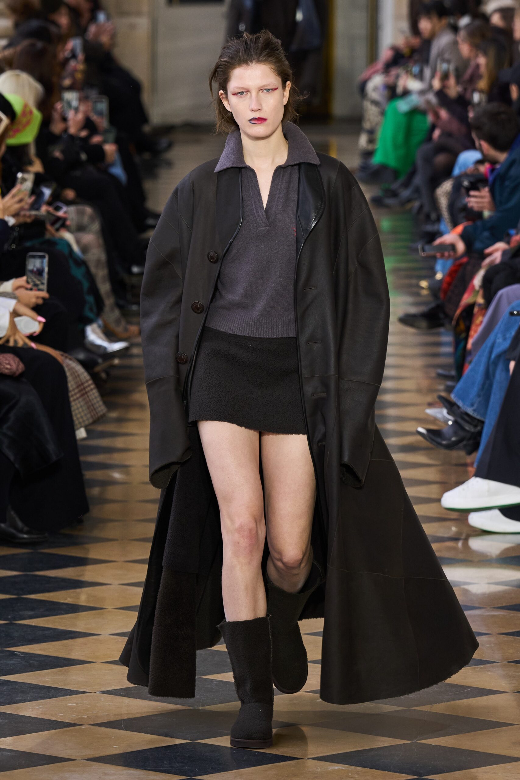 black leather coat with gray top