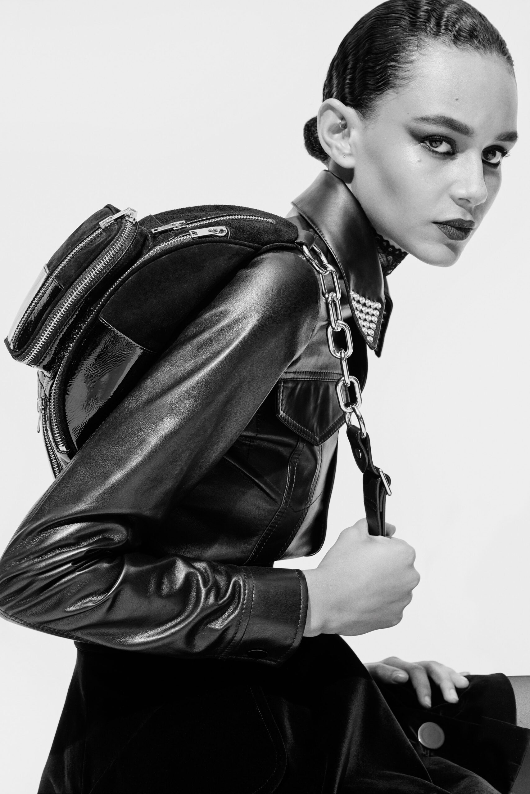 black leather fitted jacket and velvet dress