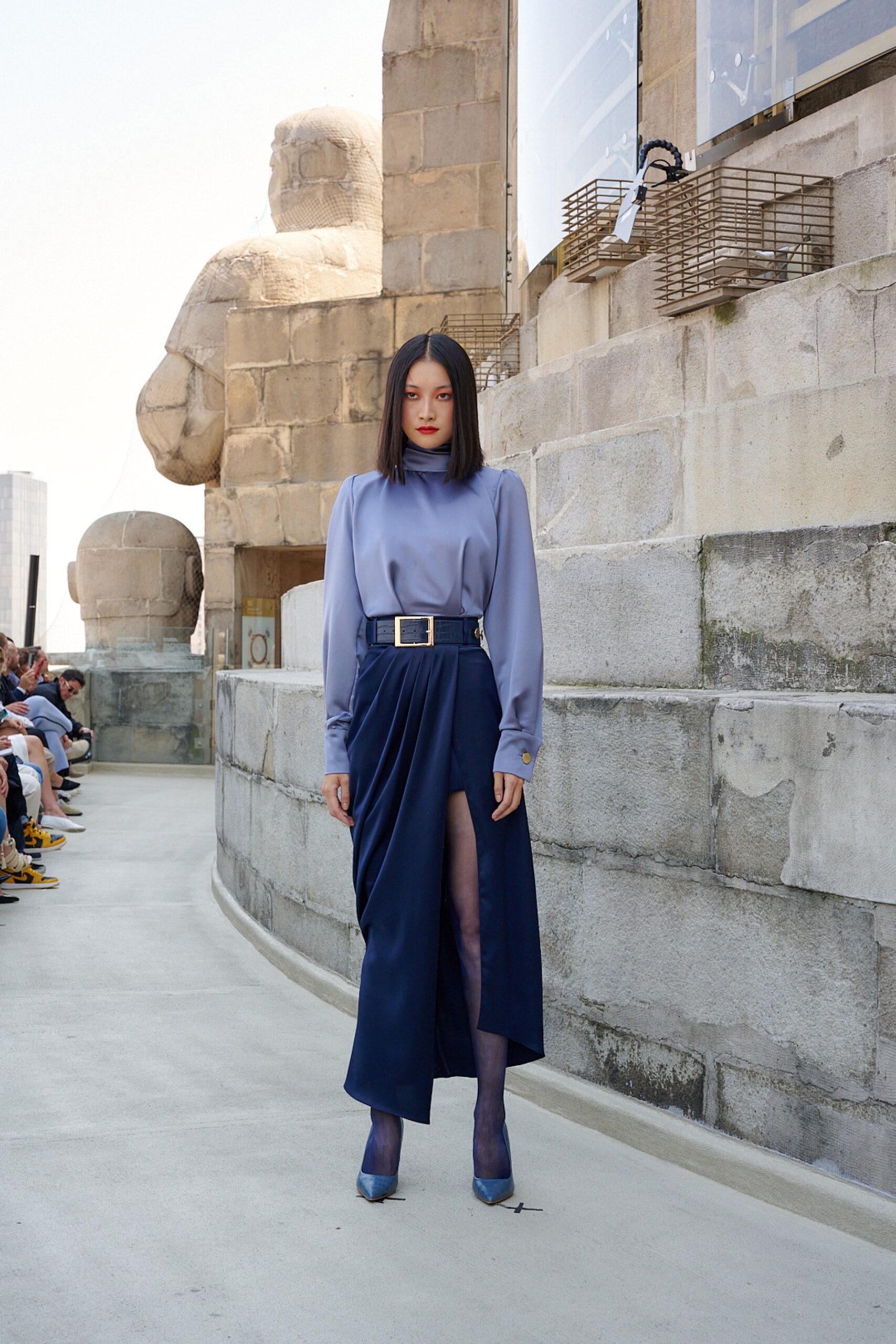 blue silk blouse and navy skirt