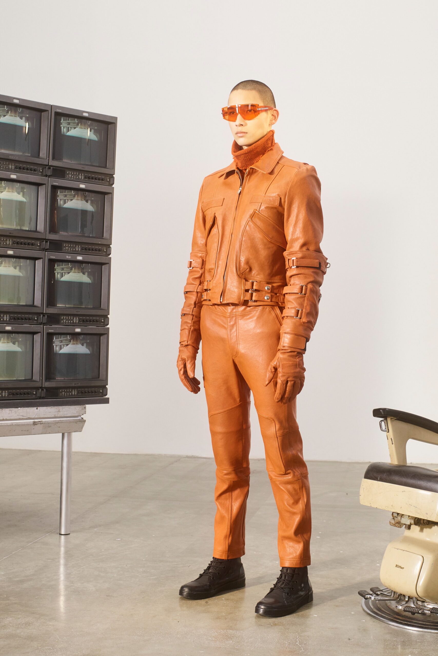 fitted orange leather jacket and pants