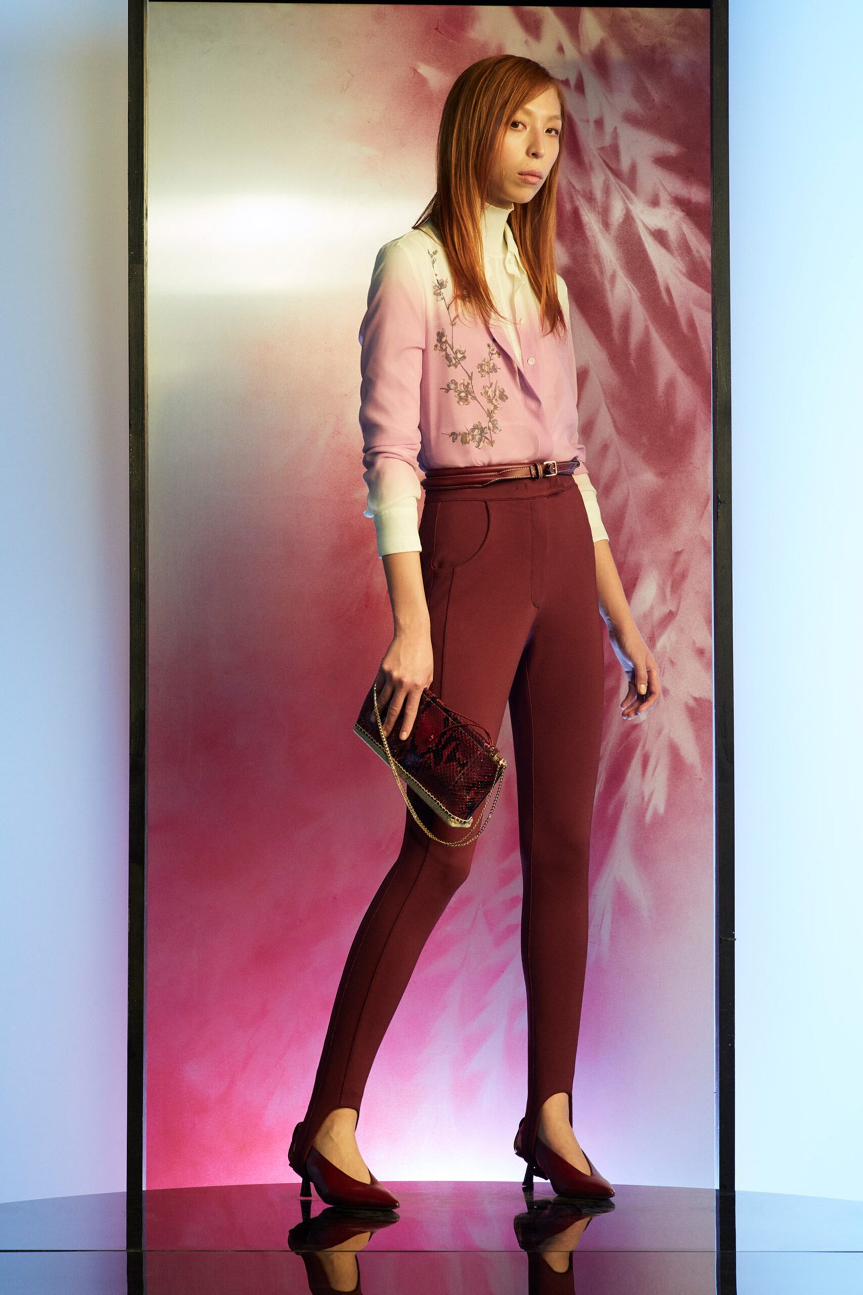 fitted pink blouse and maroon pants