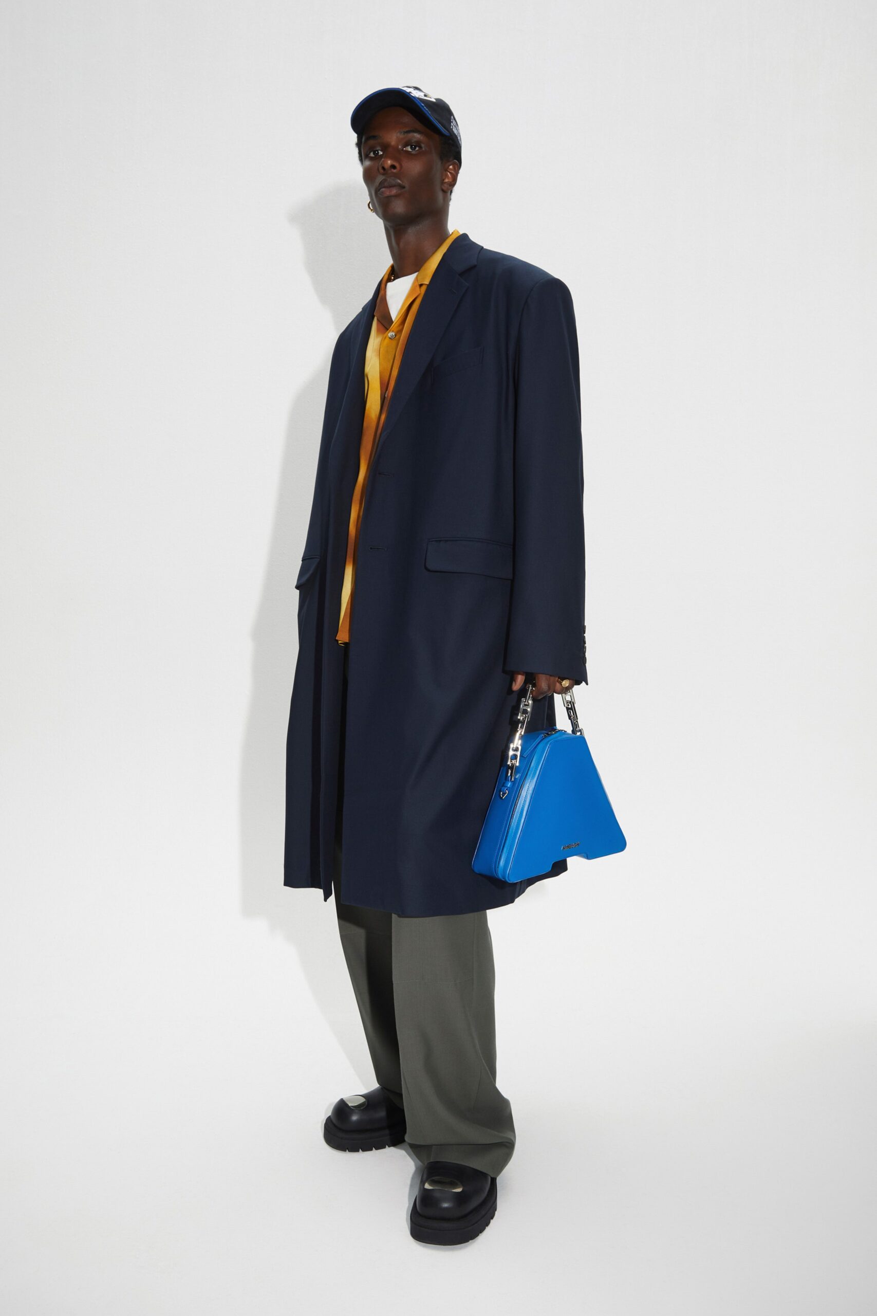 blue long-sleeve collared relaxed buttoned coat