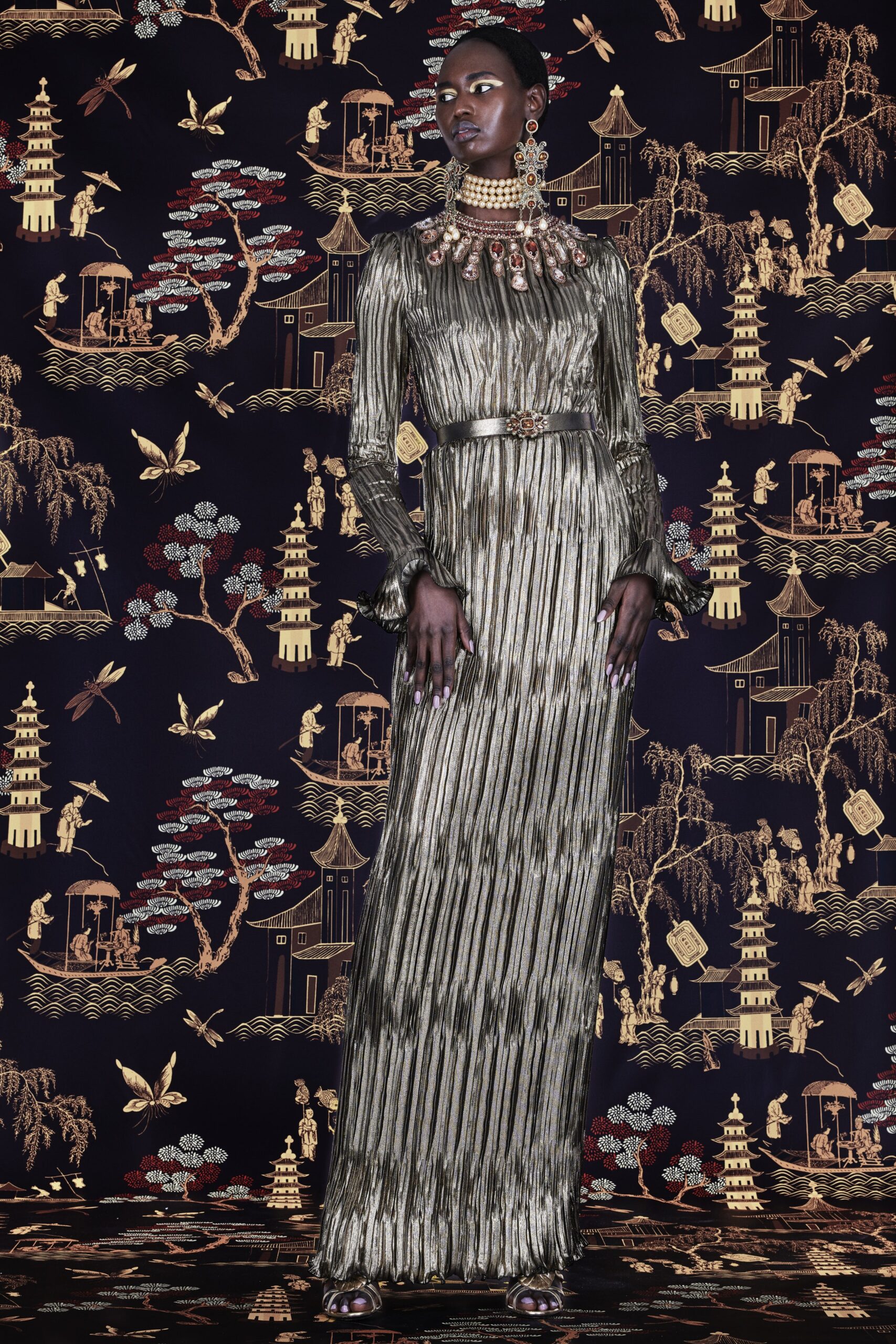 gold pleated long-sleeve gown