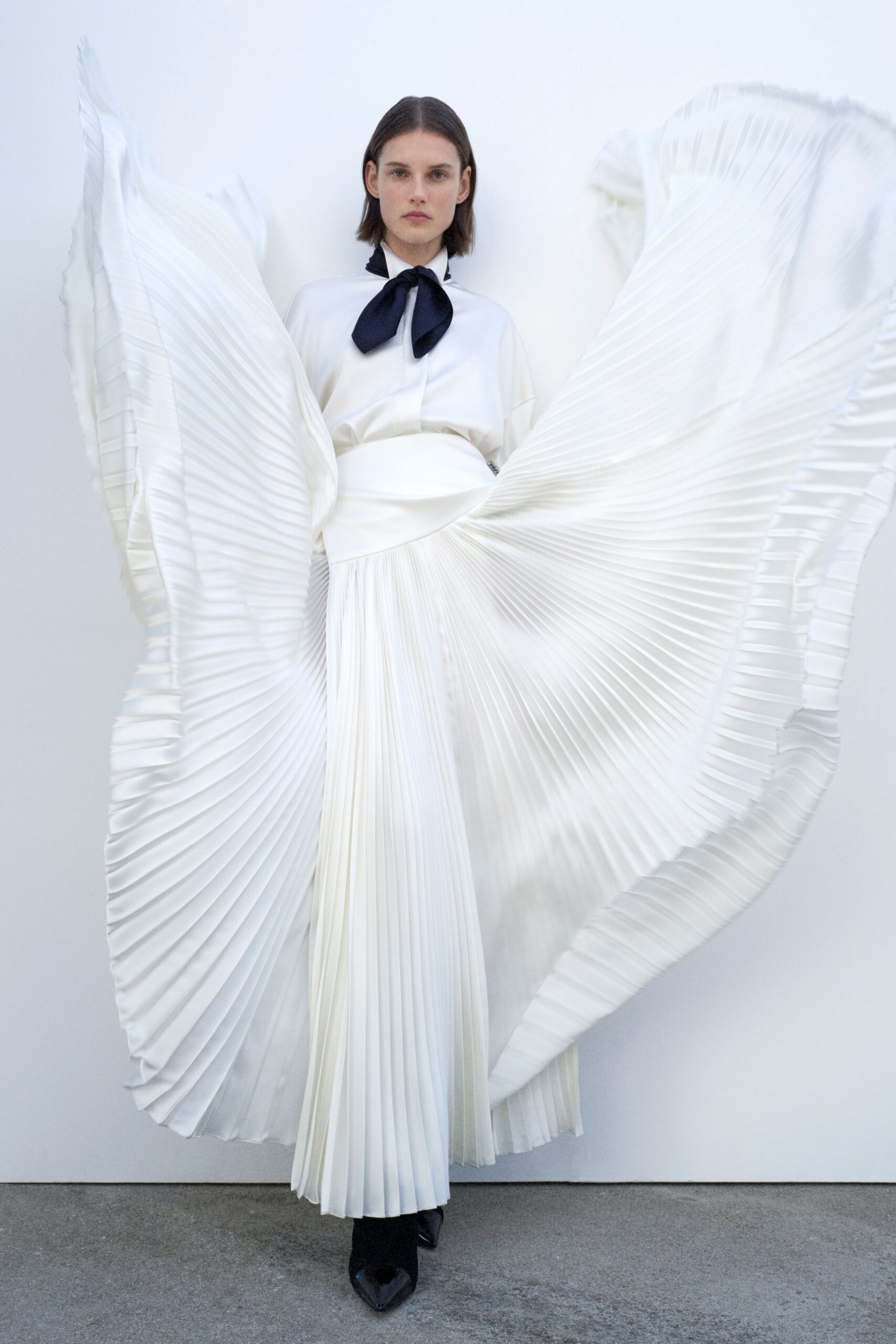 white pleated blouse and skirt