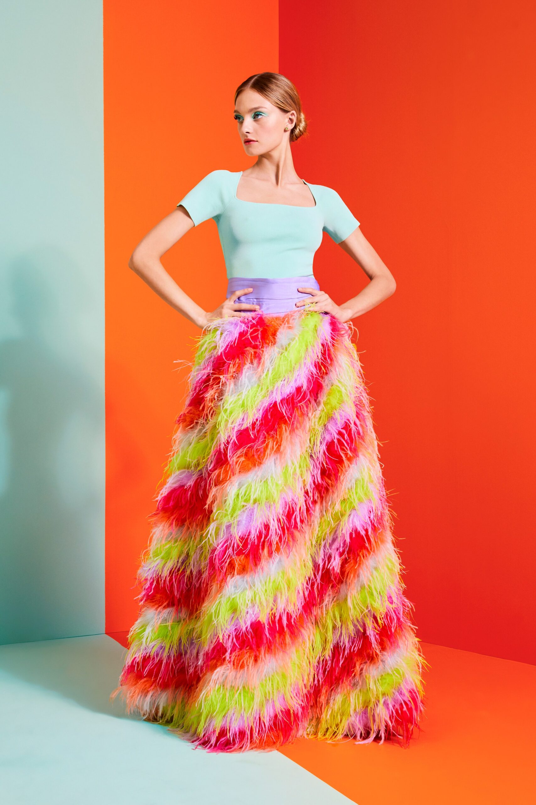 blue fitted top with multi-colored maxi skirt