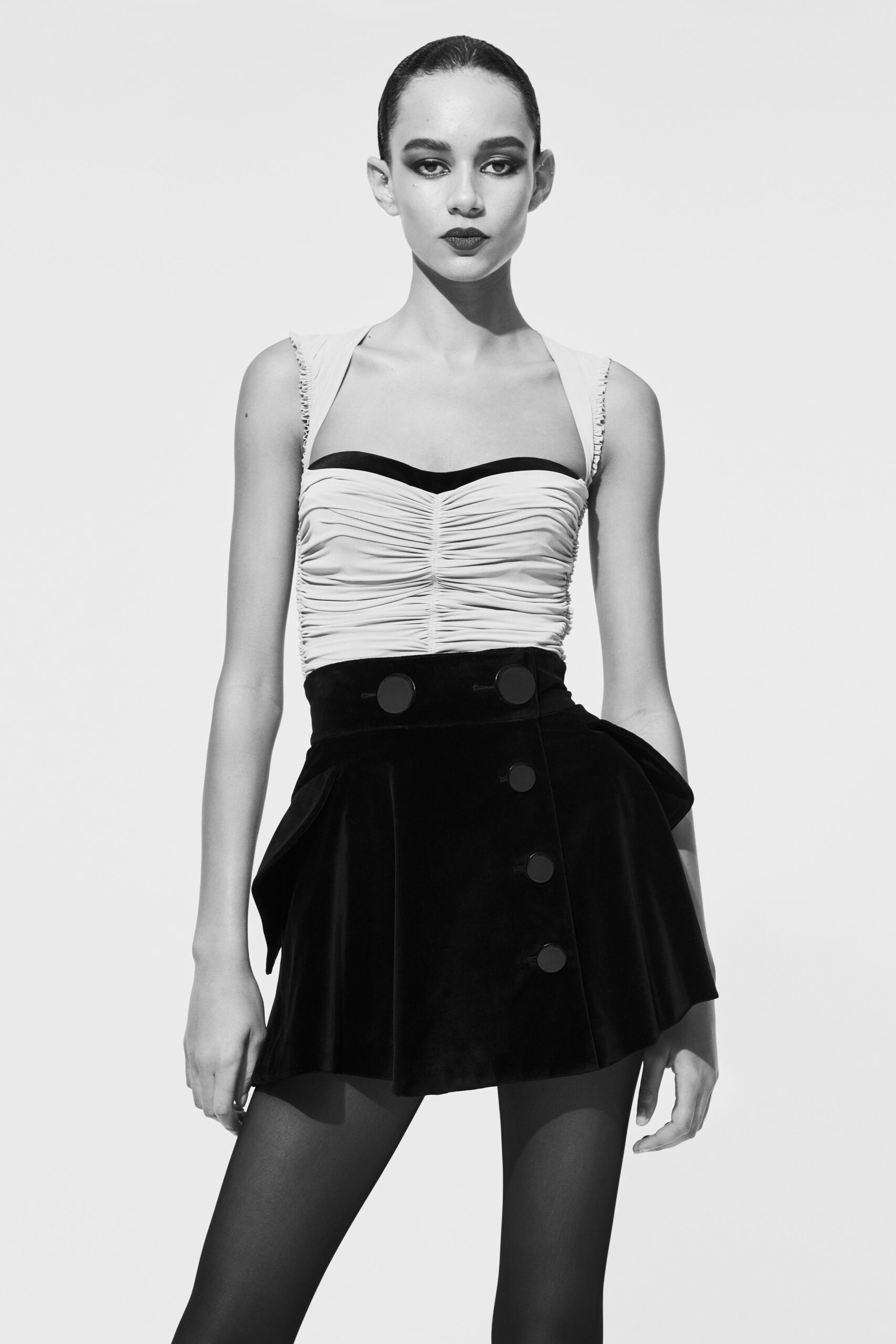 fitted white top and black skirt