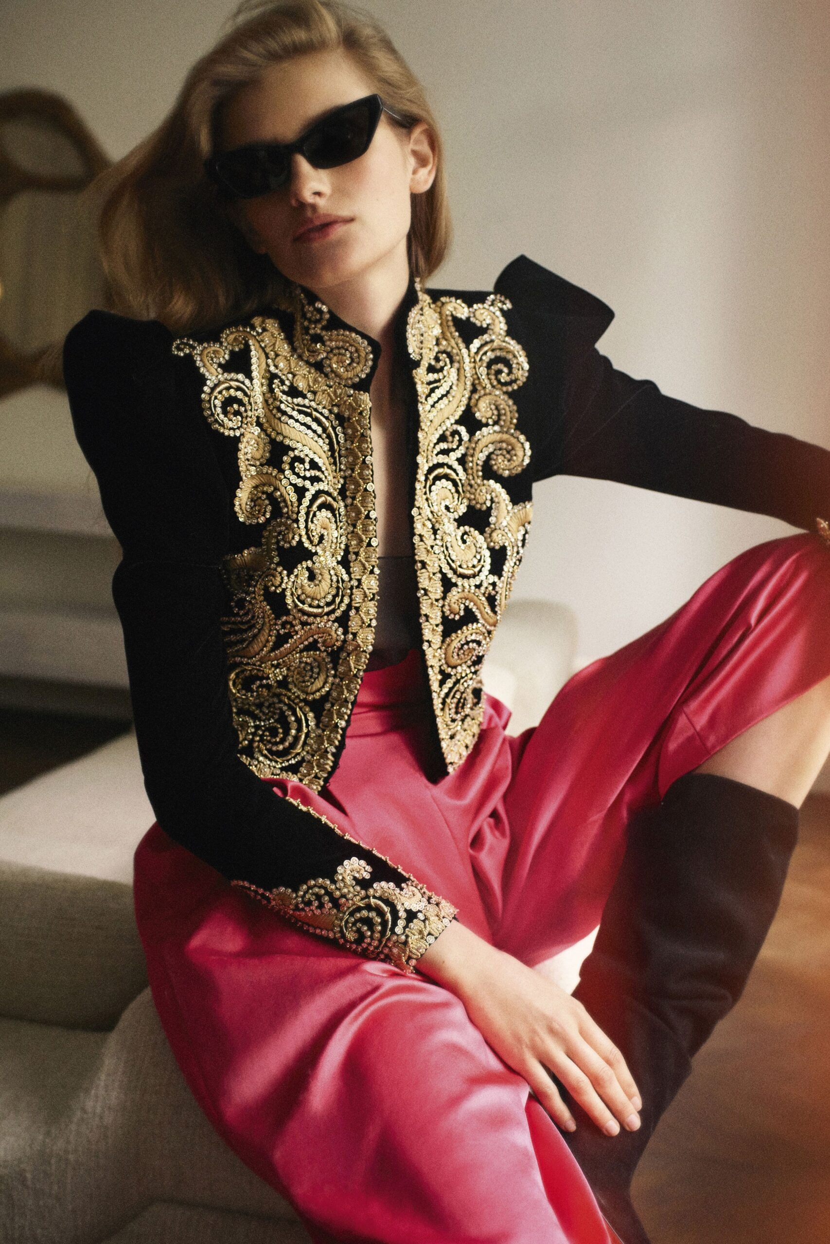 black embroidered jacket and pink pants