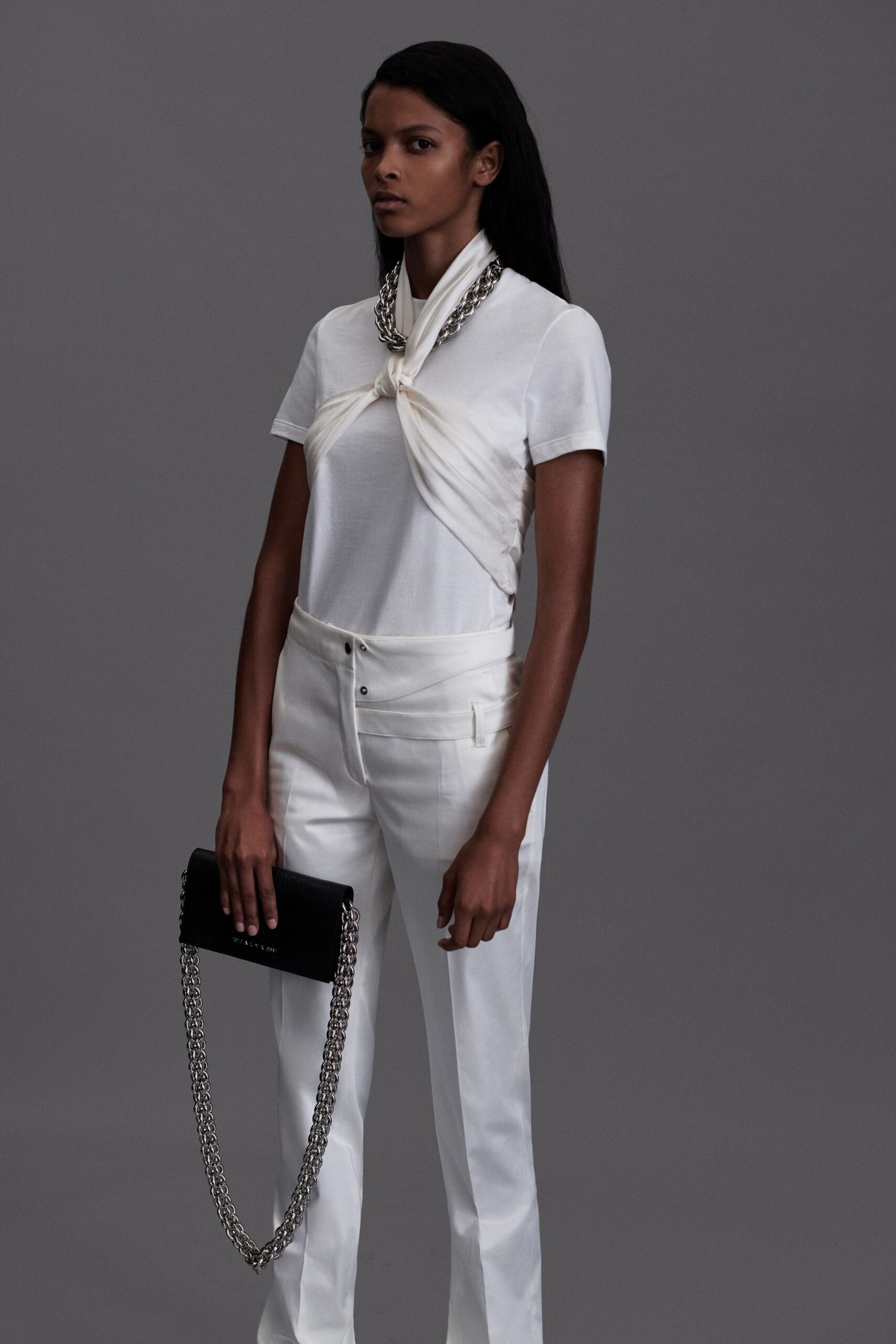 white fitted top with tailored pants