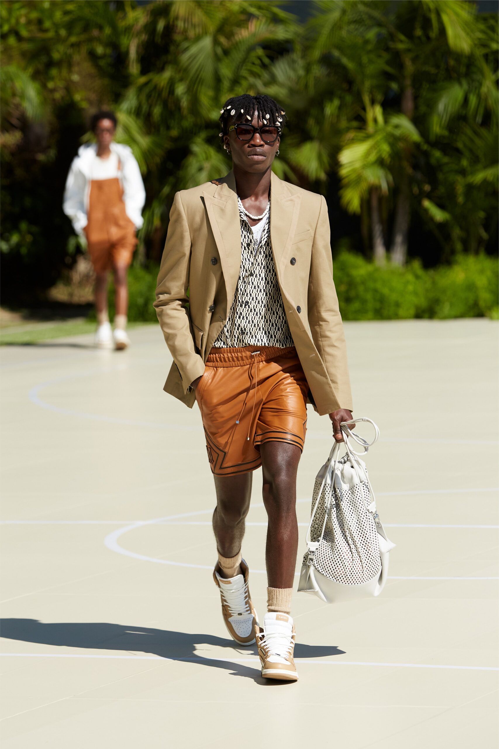beige tailored blazer with orange shorts