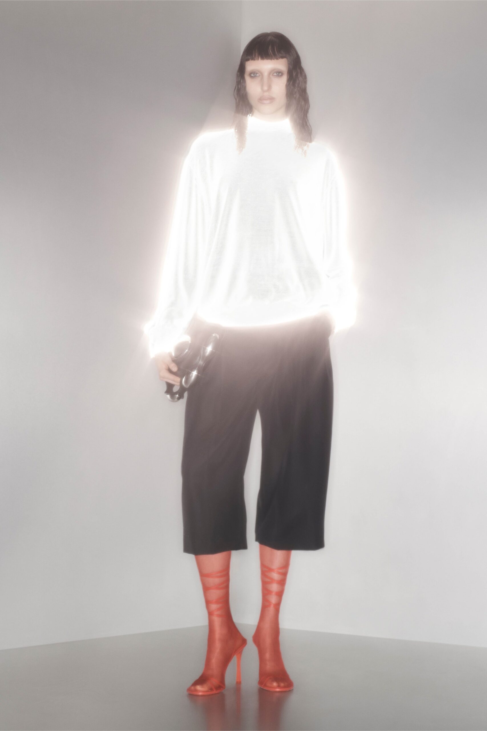white silk relaxed top with black pants