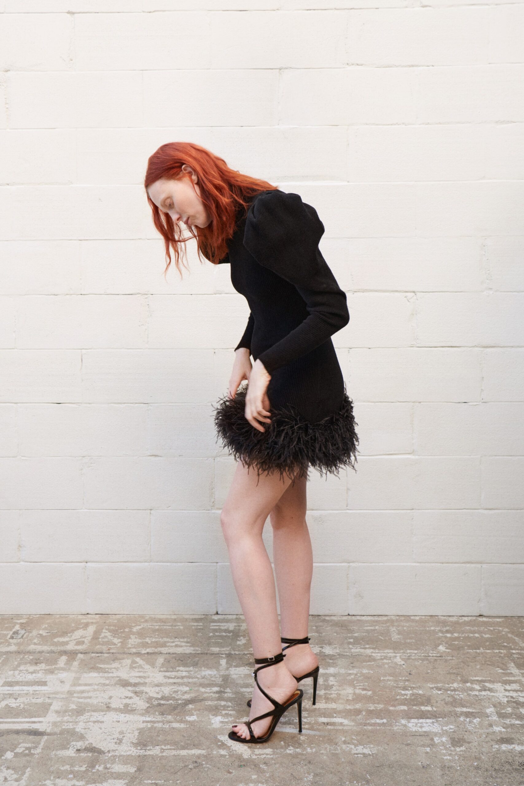 black fitted mini dress with ruffles