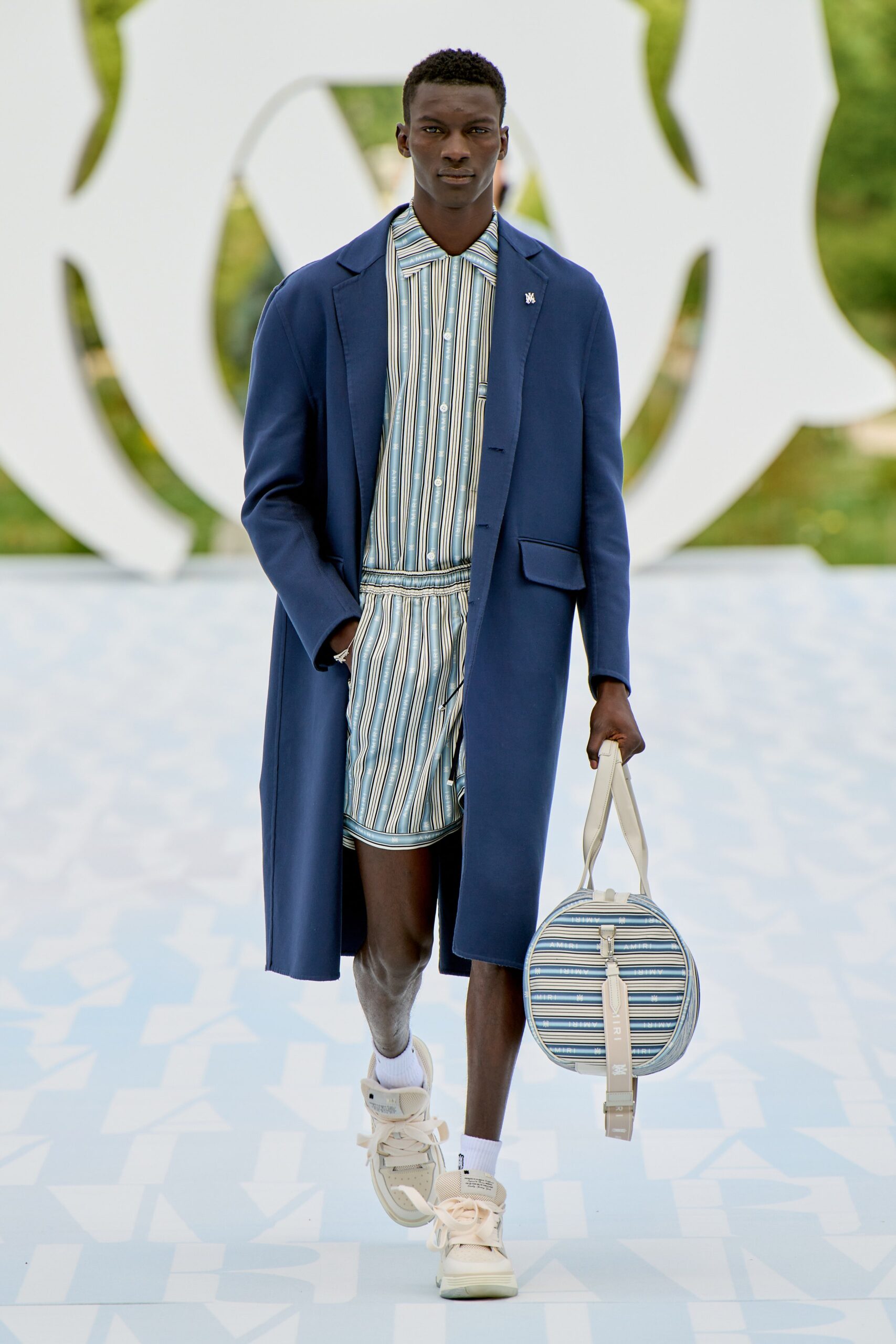 blue coat with striped shirt and shorts