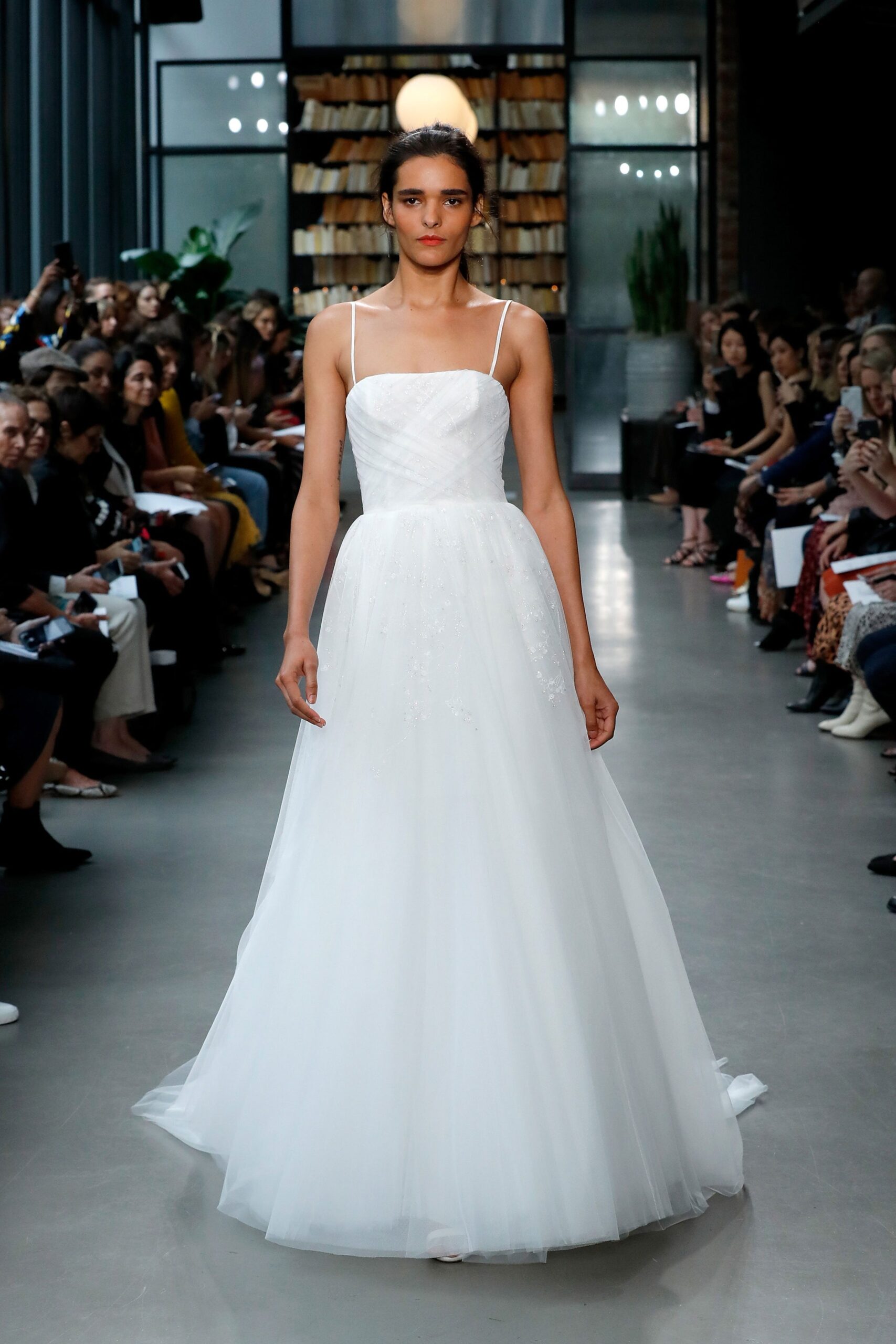 white sleeveless embroidered gown
