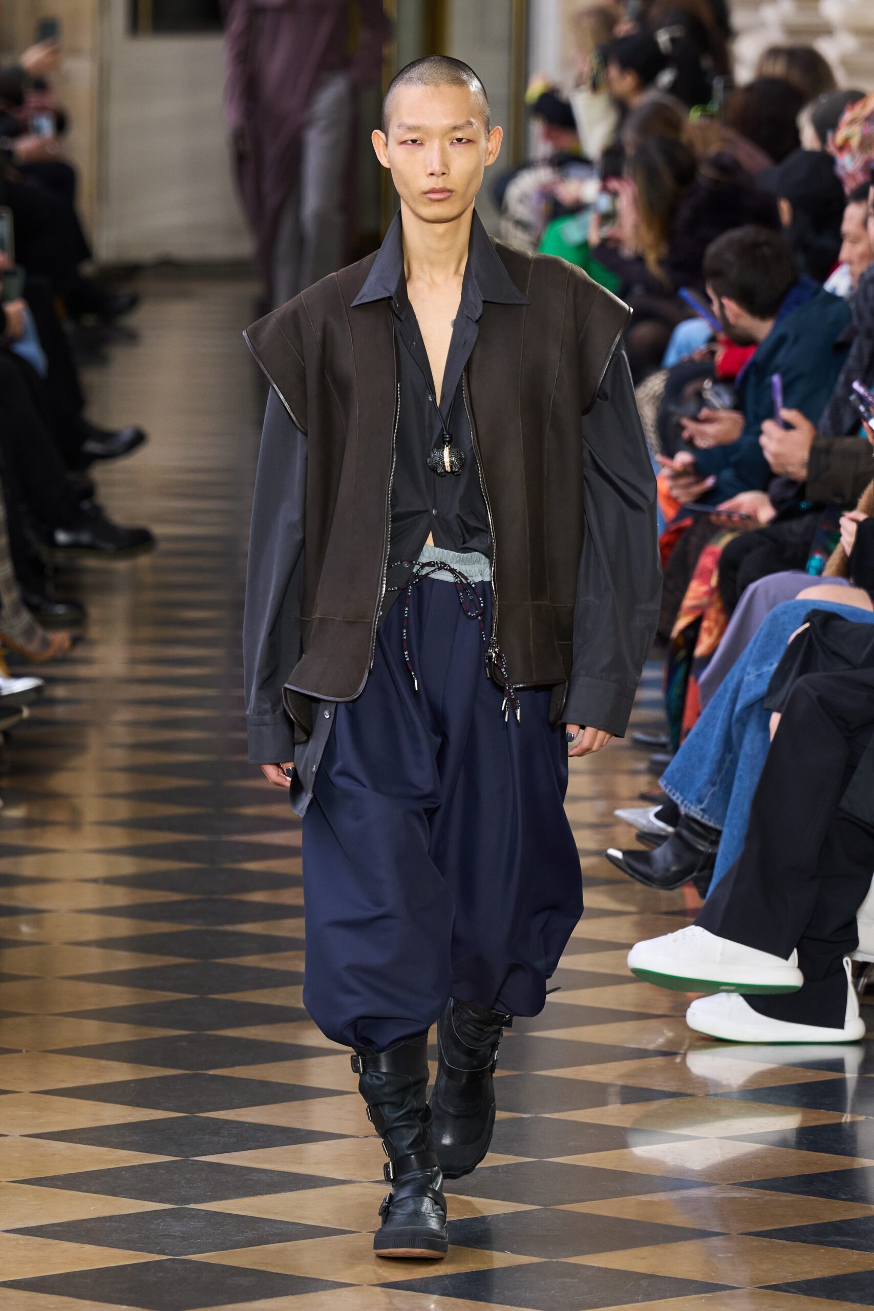 black relaxed jacket and blue wide-leg pants