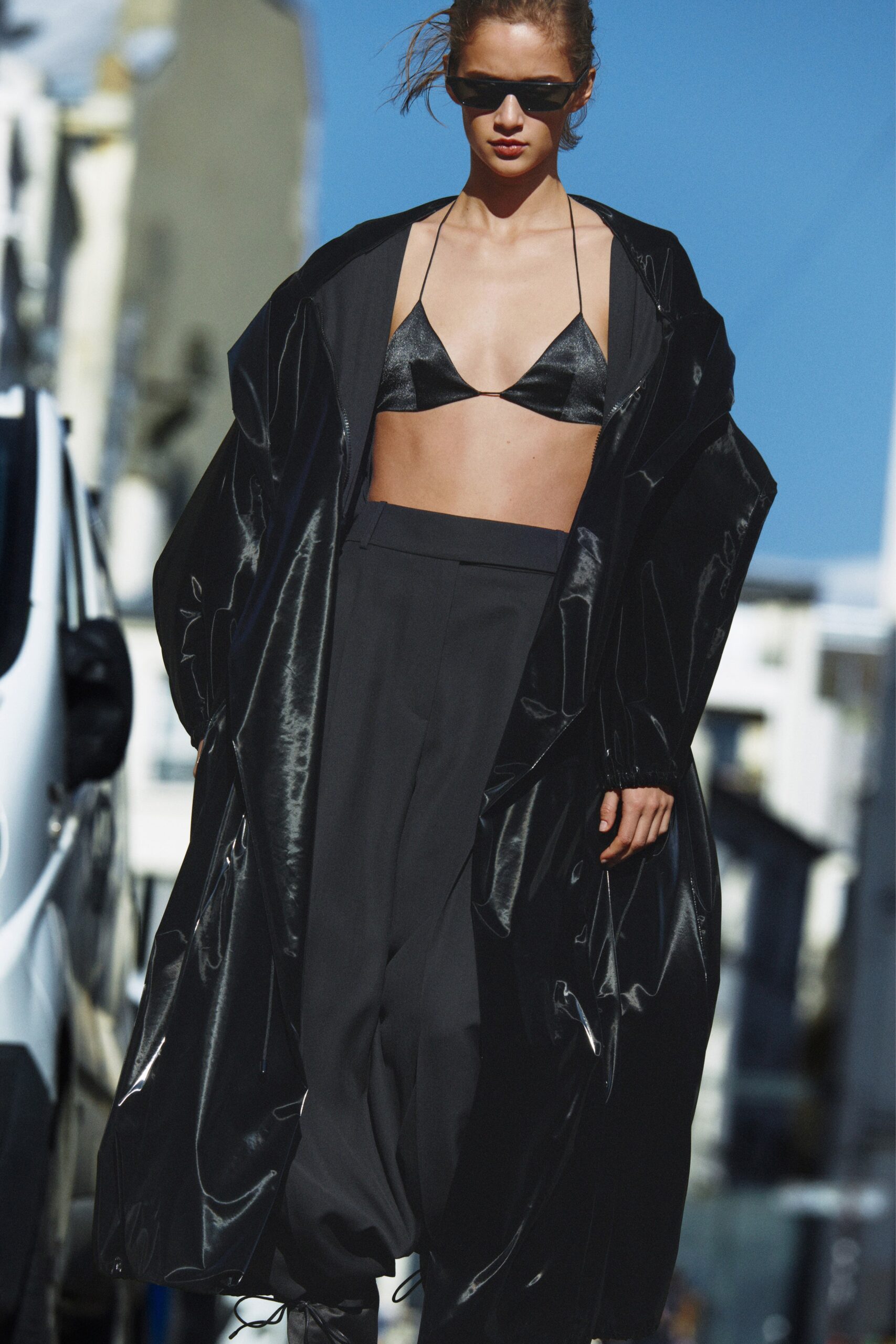 black vinyl long-sleeve collared relaxed zippered shiny coat