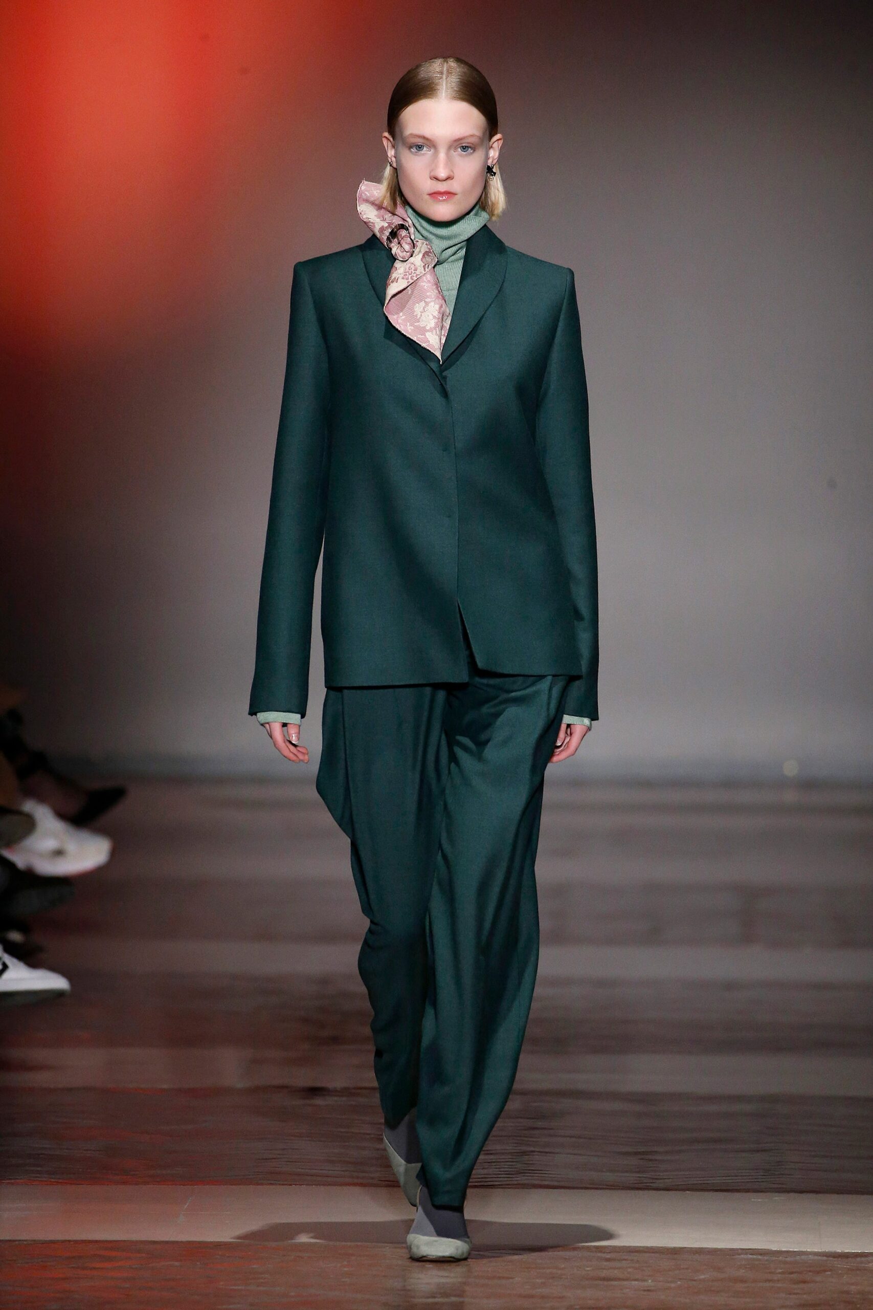 green tailored suit with blue top