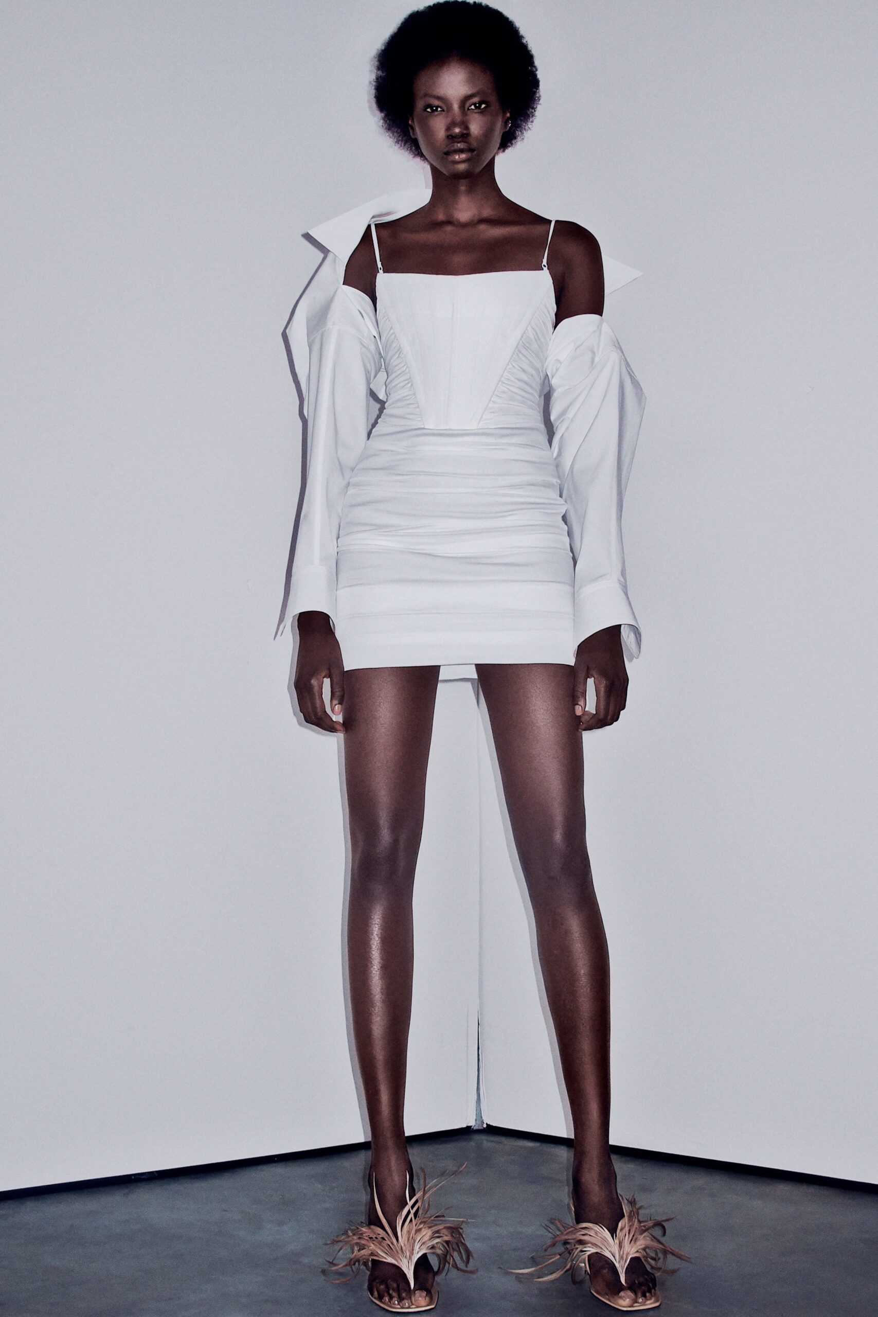 white fitted mini dress with oversized jacket
