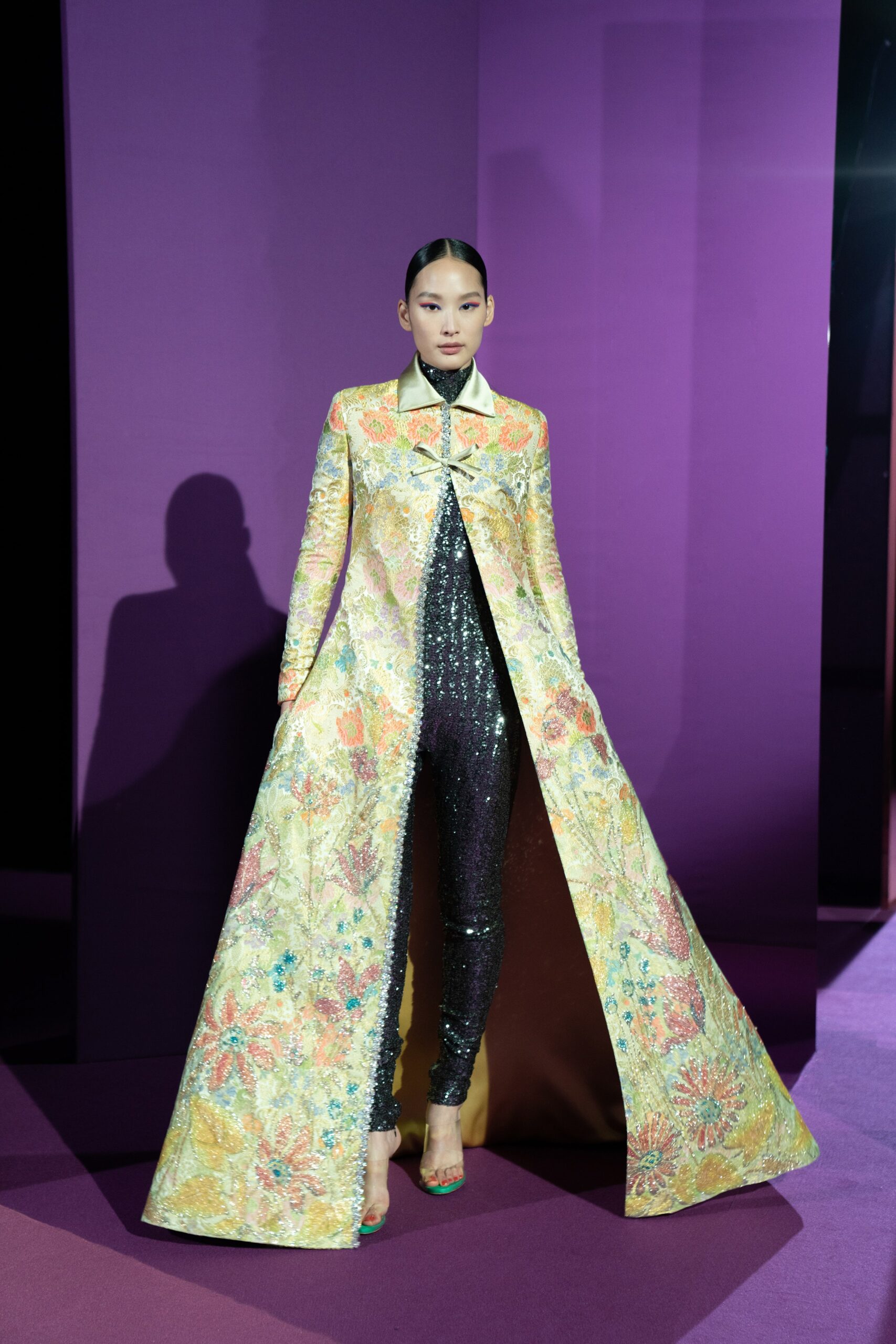 embroidered yellow coat with black jumpsuit