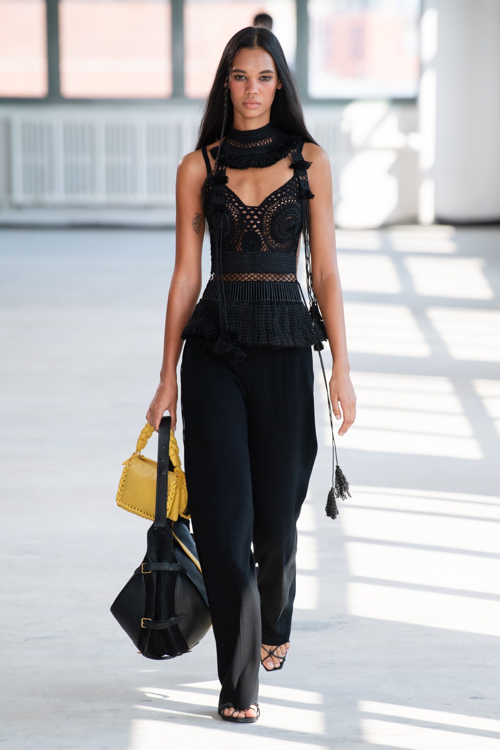 black fitted top with tailored pants