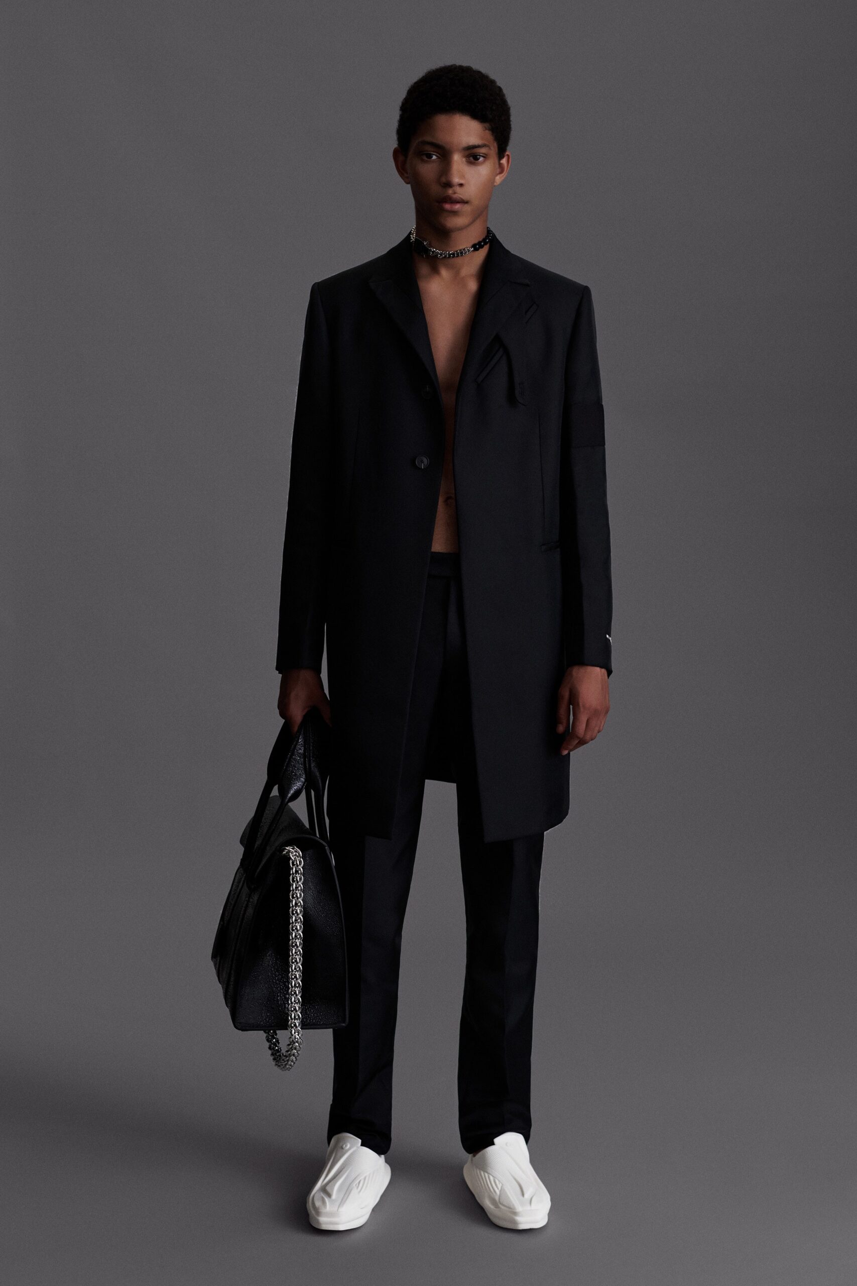 black wool coat with tailored pants