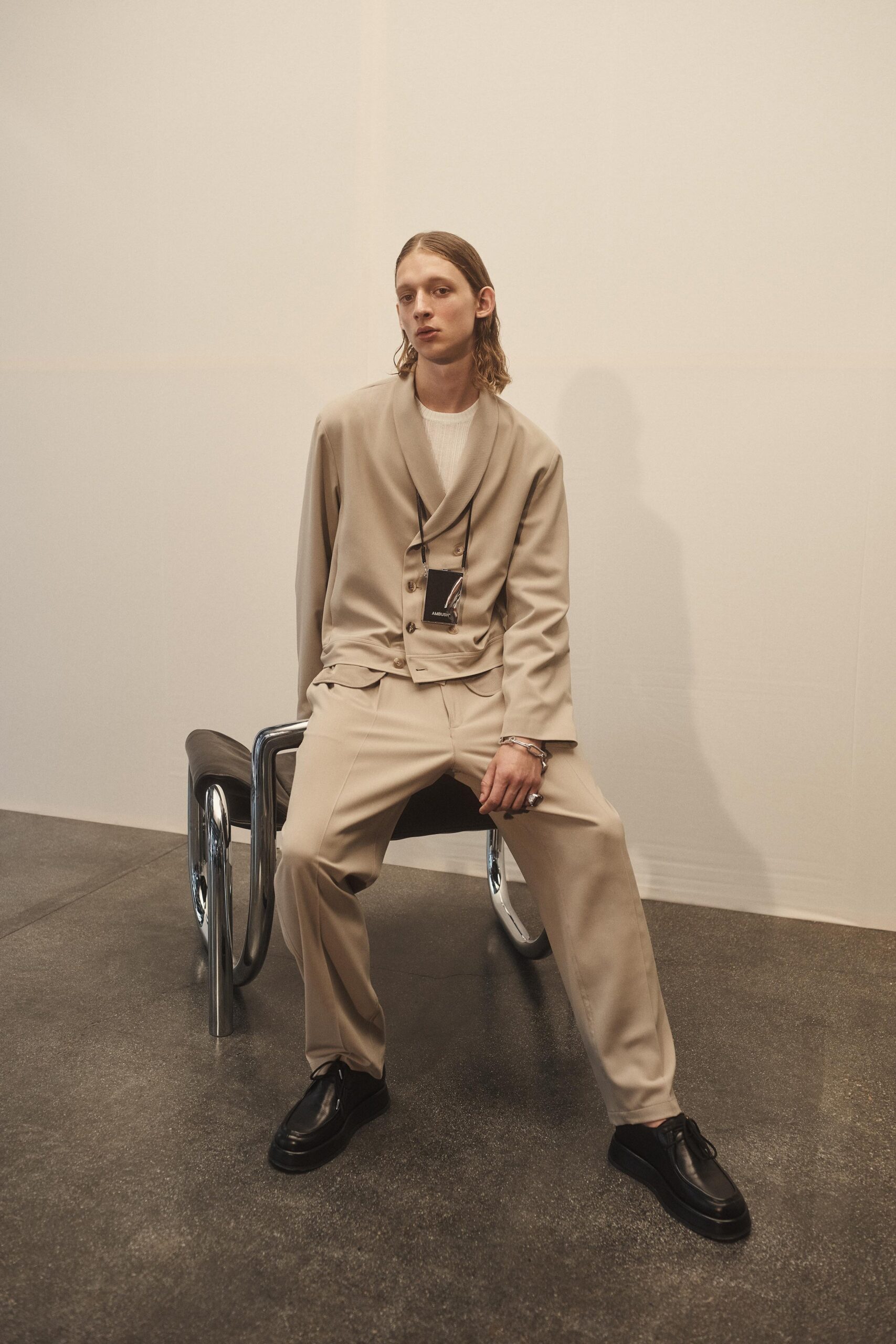 beige relaxed suit with white shirt
