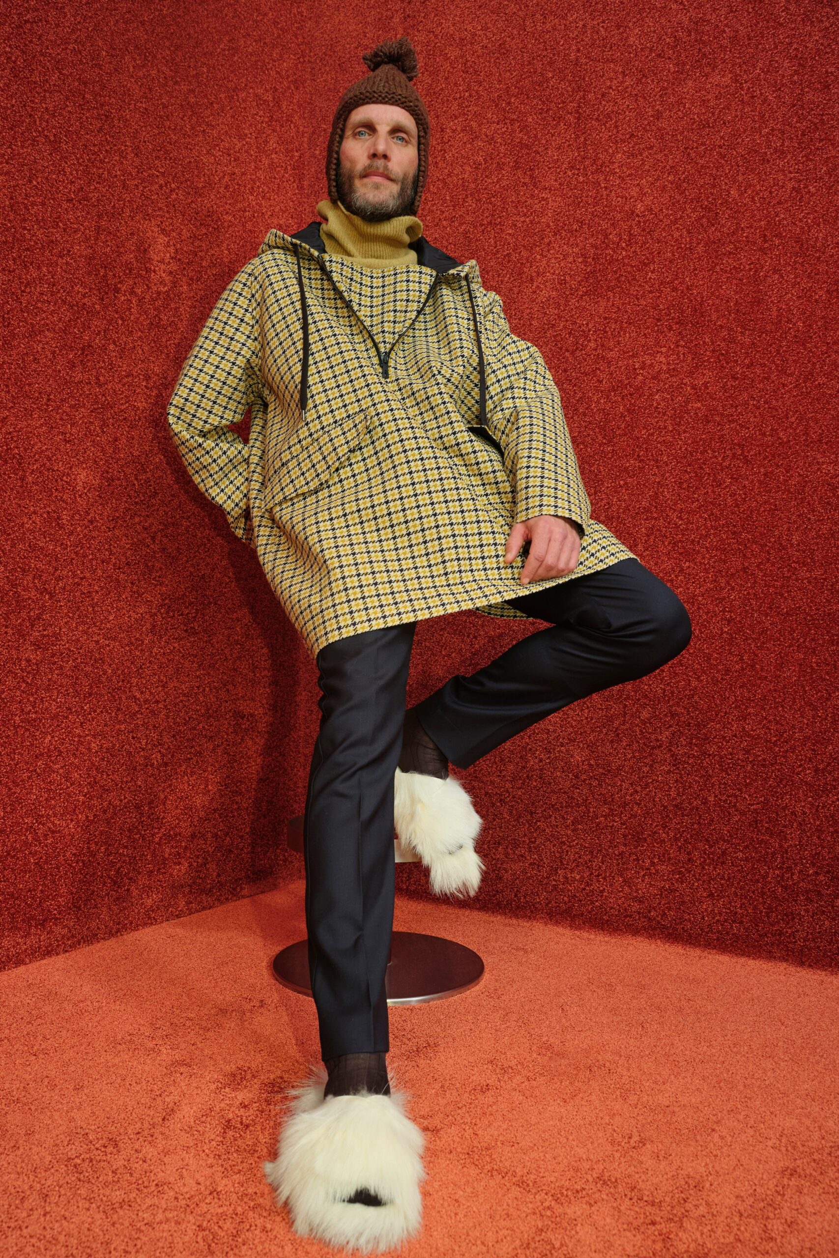 checked yellow poncho with black pants