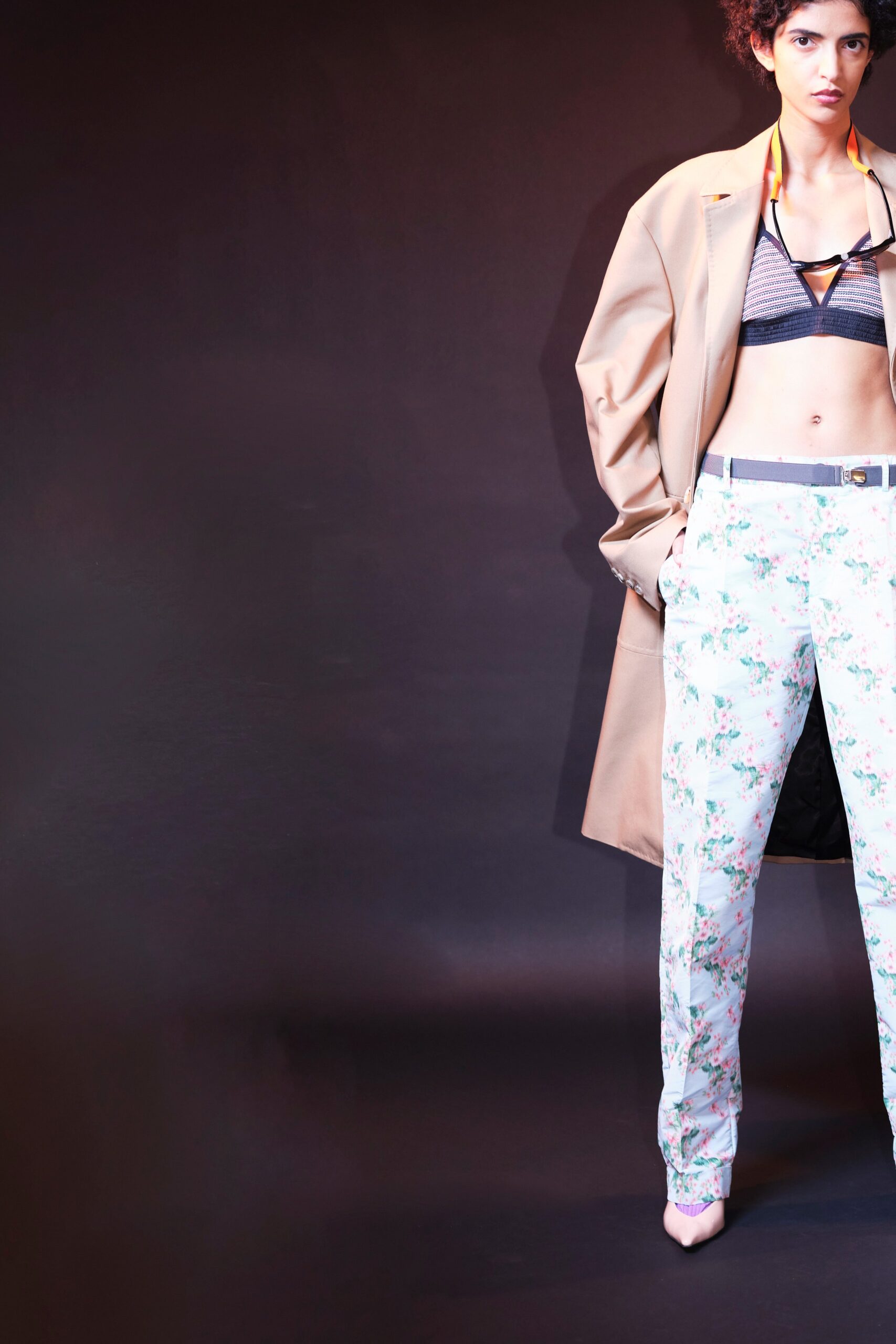 beige coat black bra floral pants