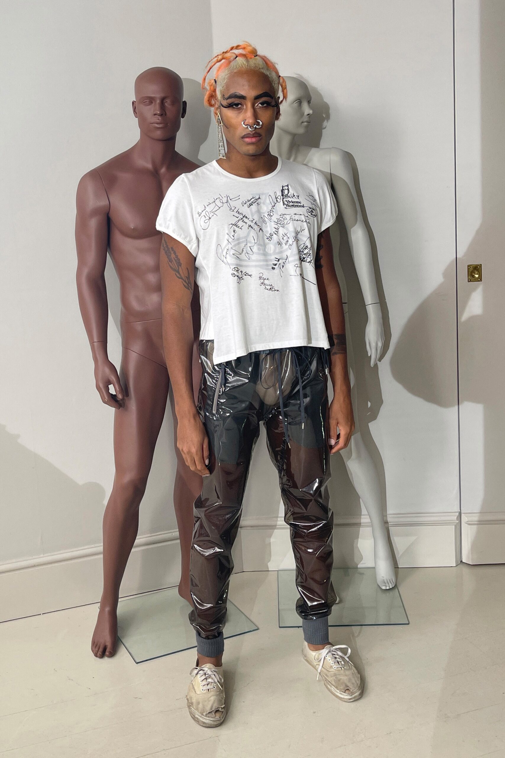 white t-shirt and black vinyl pants