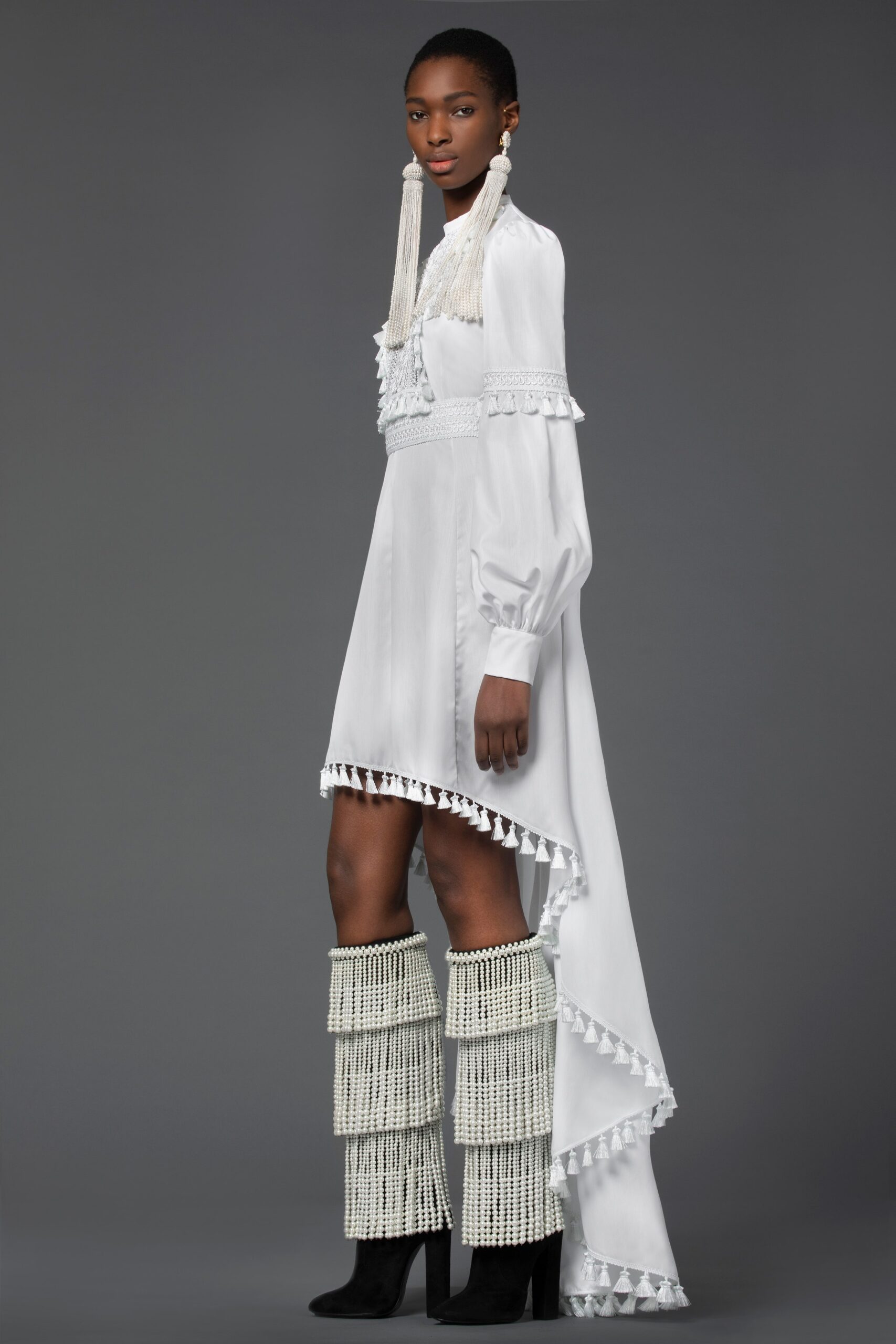 white asymmetric dress with black boots