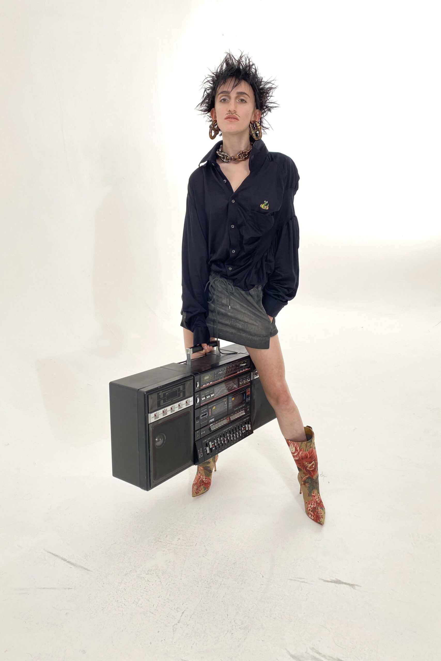 black relaxed shirt gray fitted skirt