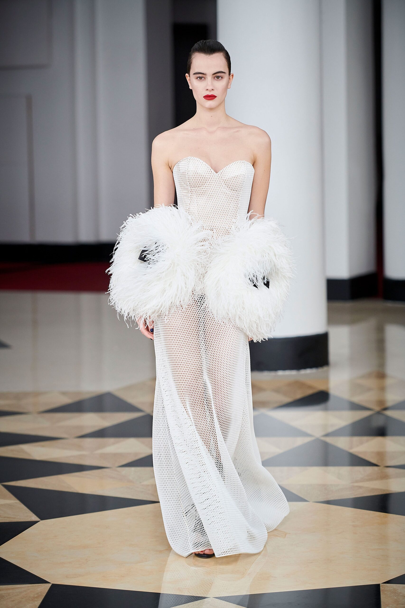 white strapless mesh gown with feathers