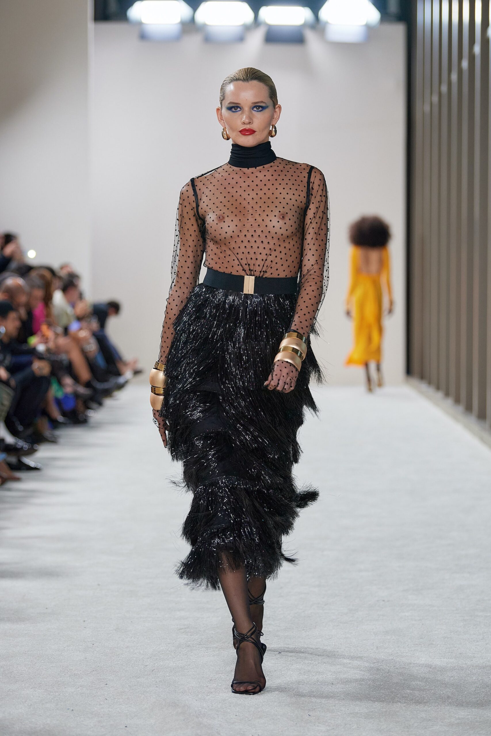 black mesh top and feathered skirt