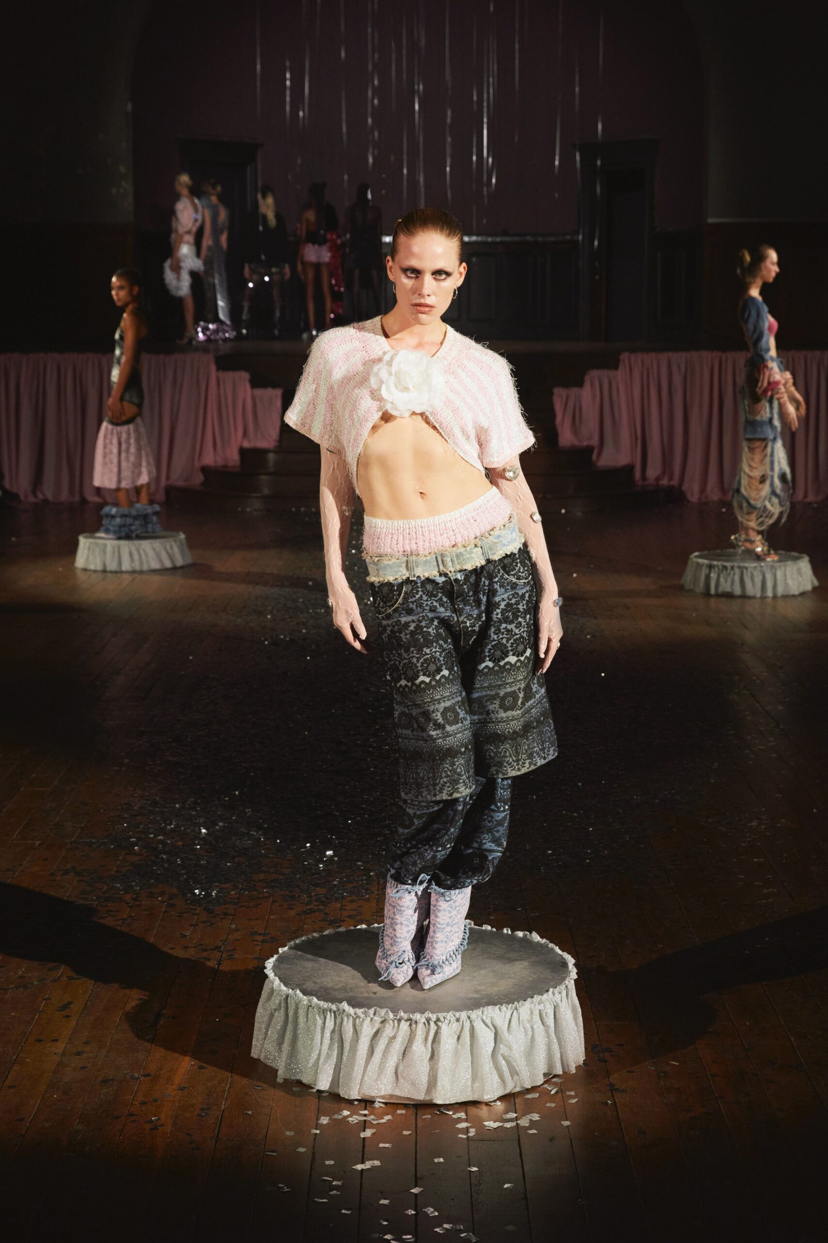 pink cropped top with black flared pants