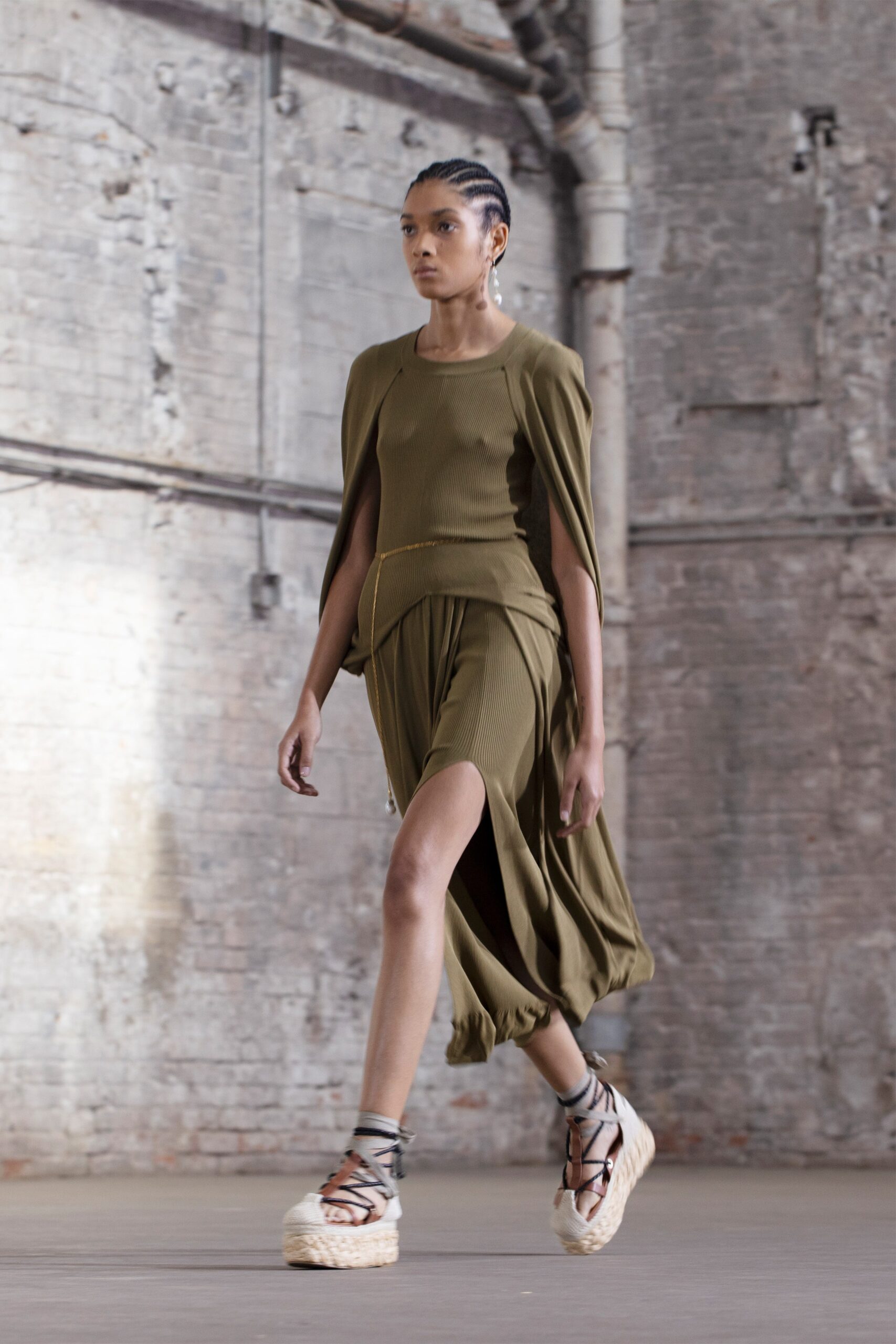 green fitted midi dress with platform shoes