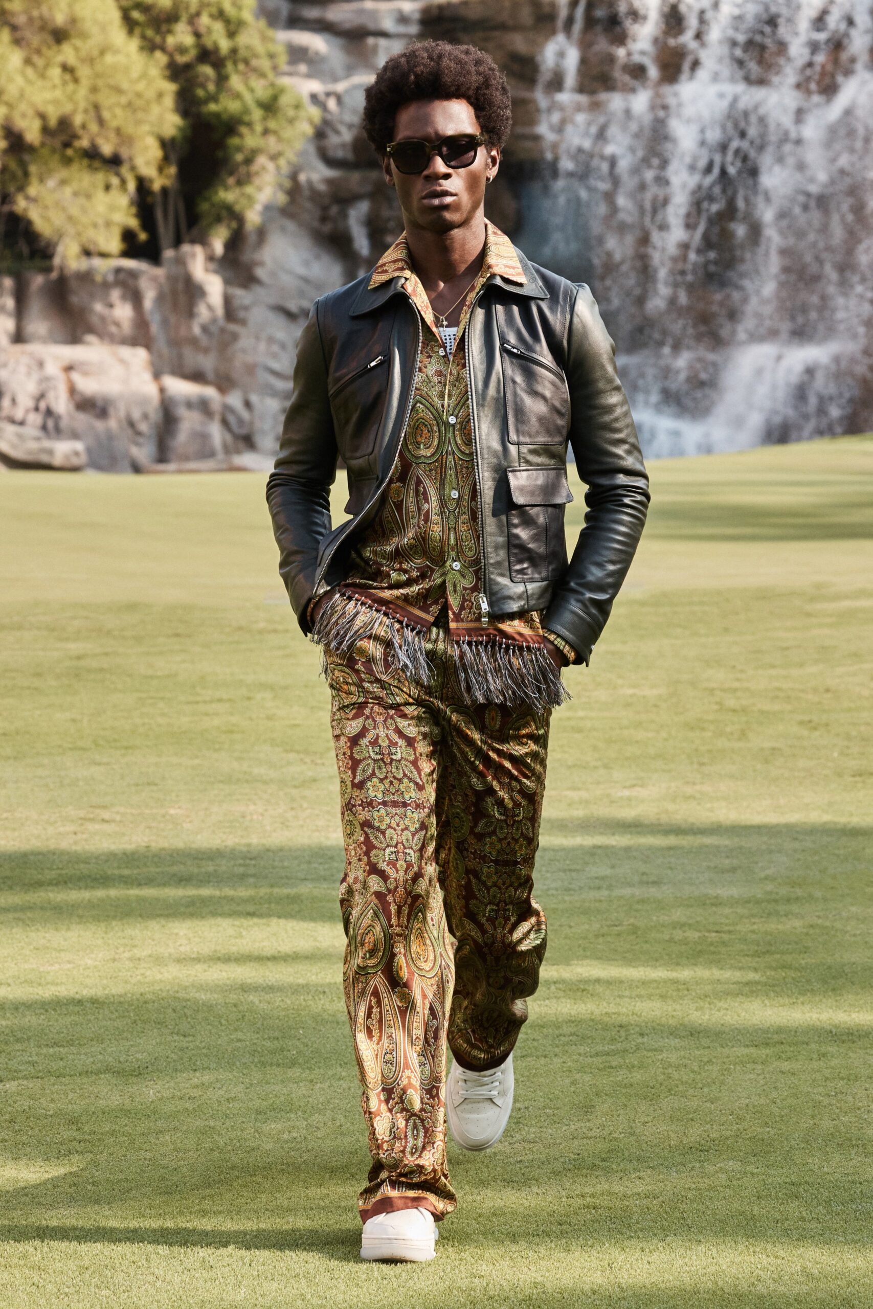 black leather jacket with printed shirt and flared pants