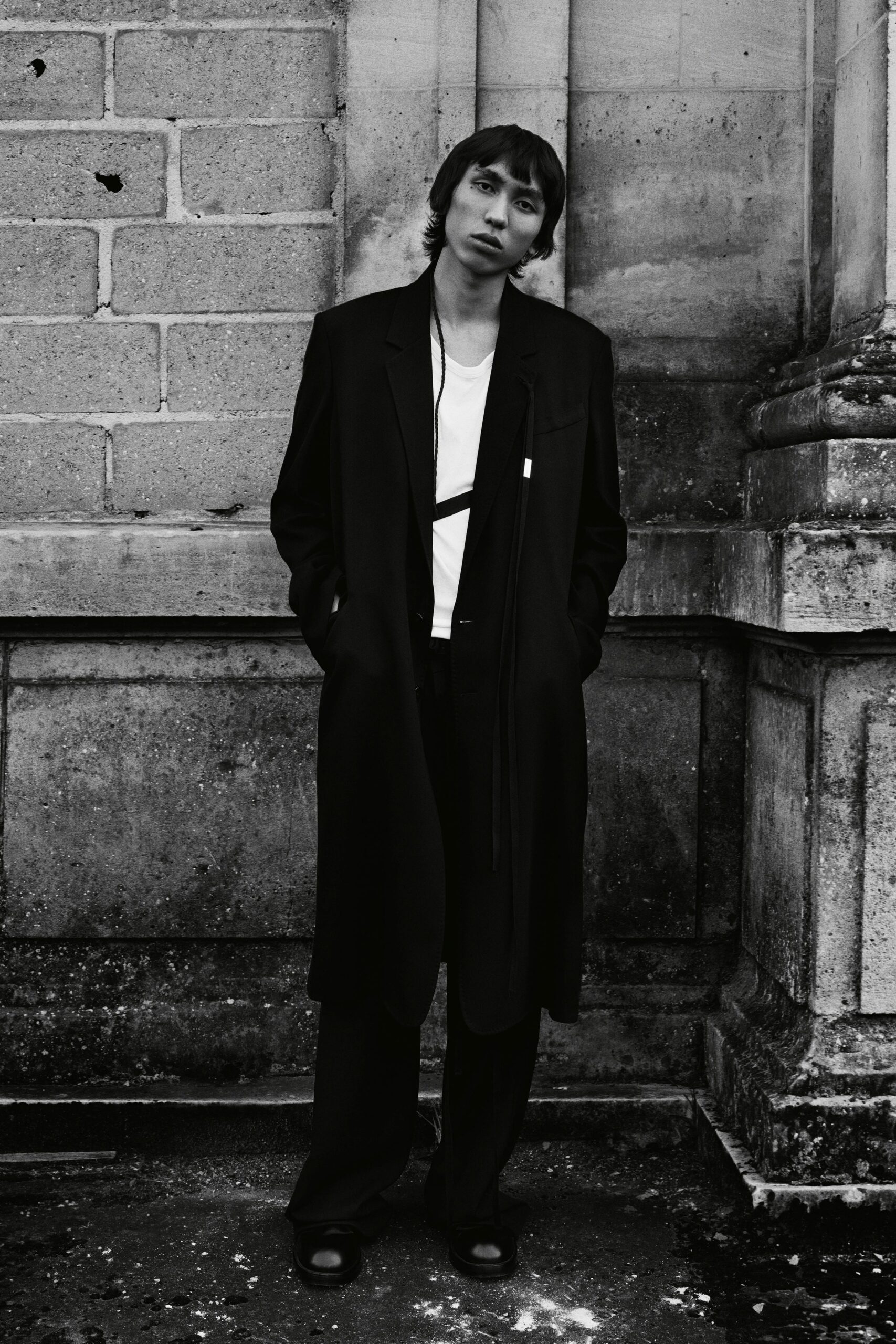 black wool coat white t-shirt black pants