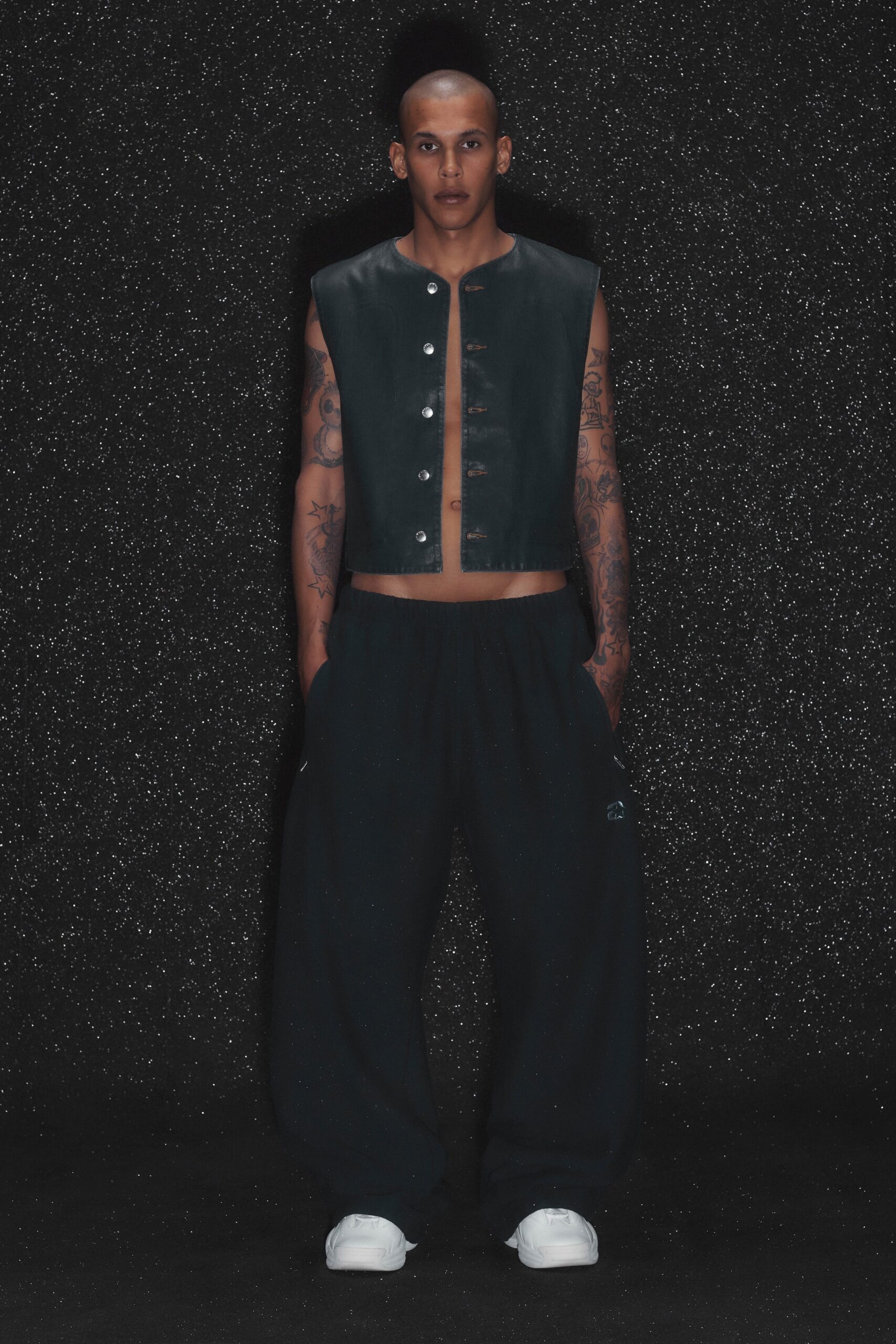 black leather sleeveless collared fitted buttoned vest