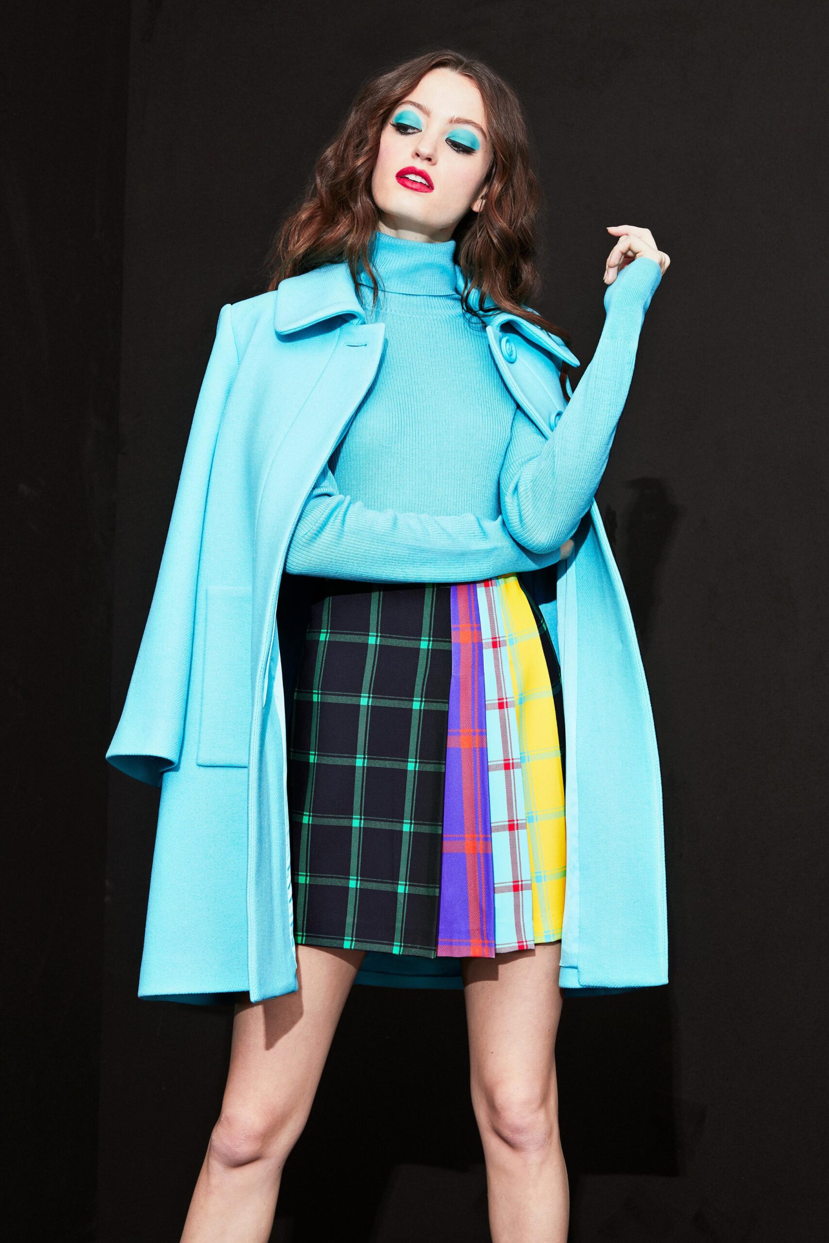 blue coat with multi-pleated skirt