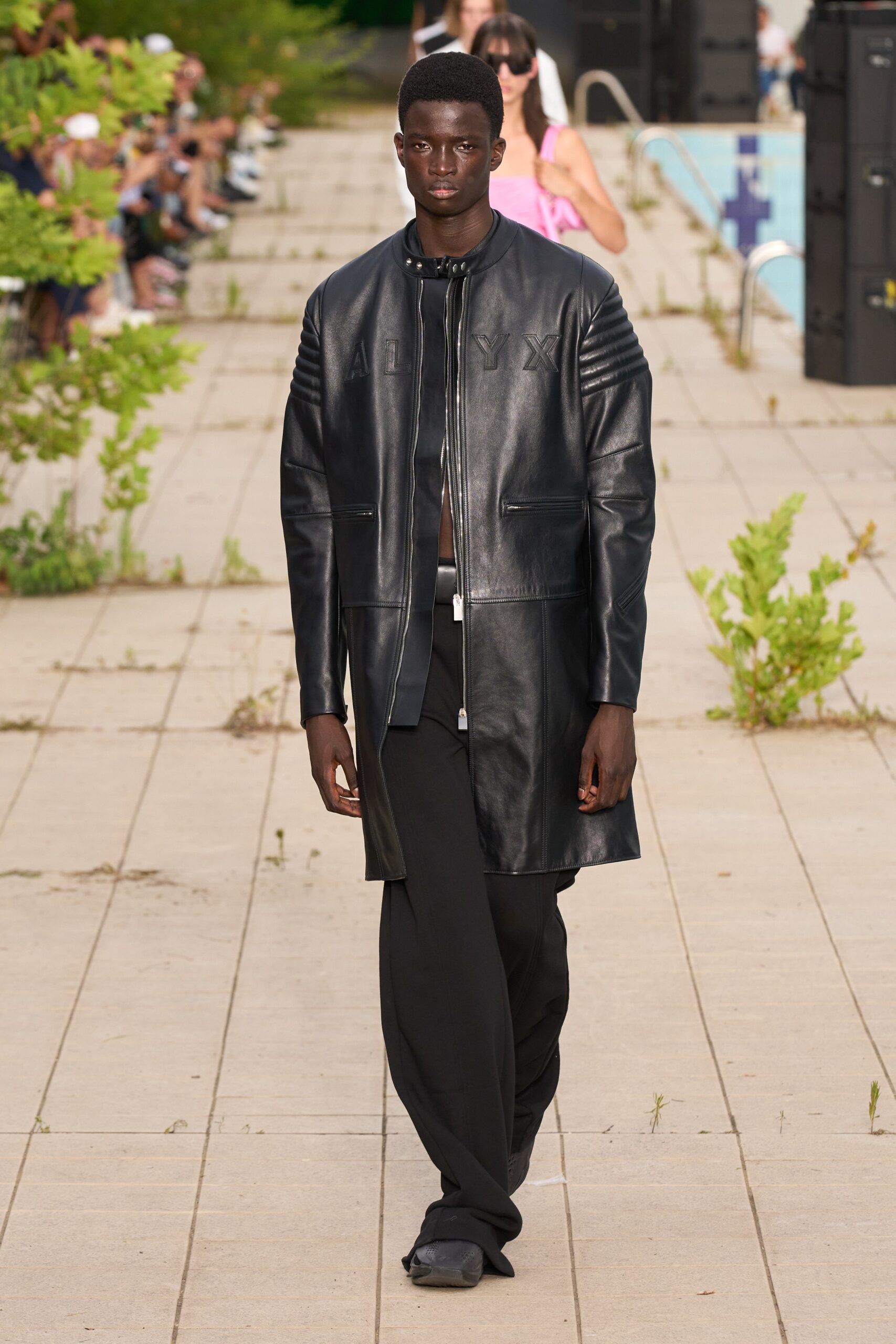 black leather coat and relaxed pants