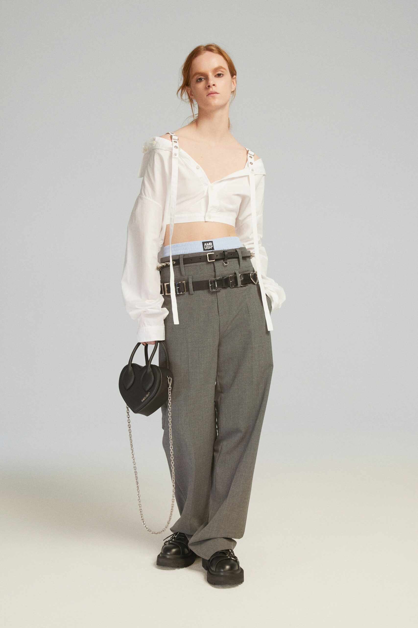 white relaxed shirt gray pants