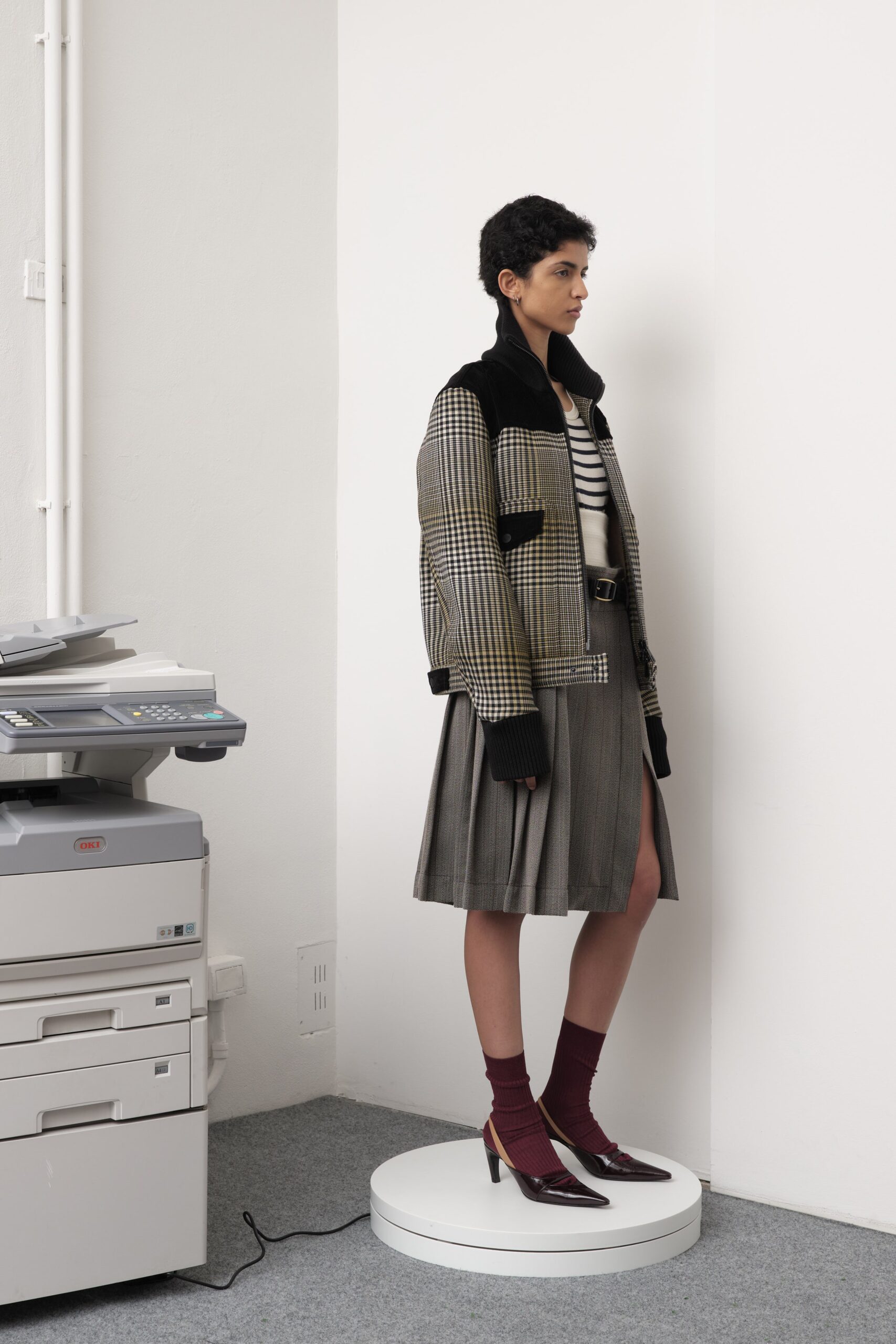 tailored jacket with pleated skirt