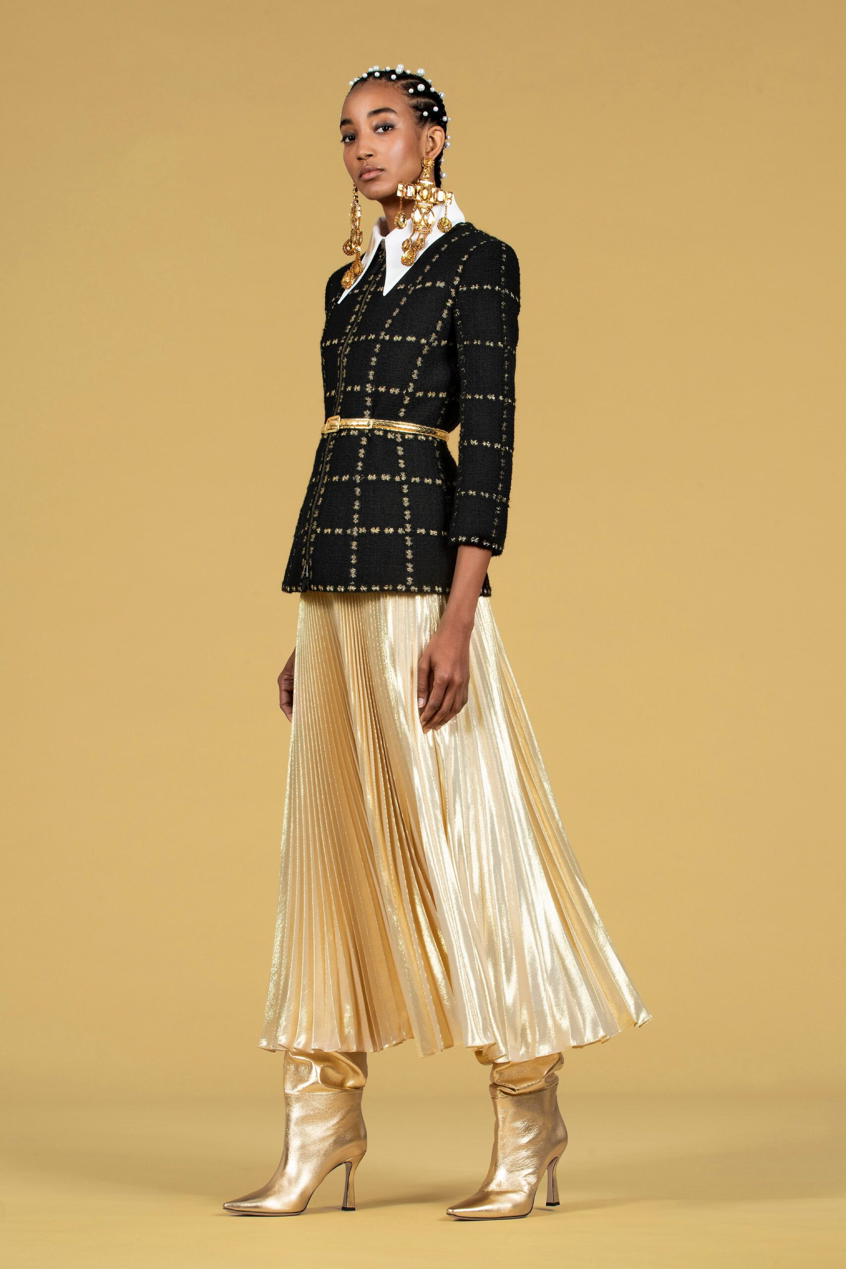 black tailored blazer gold pleated skirt
